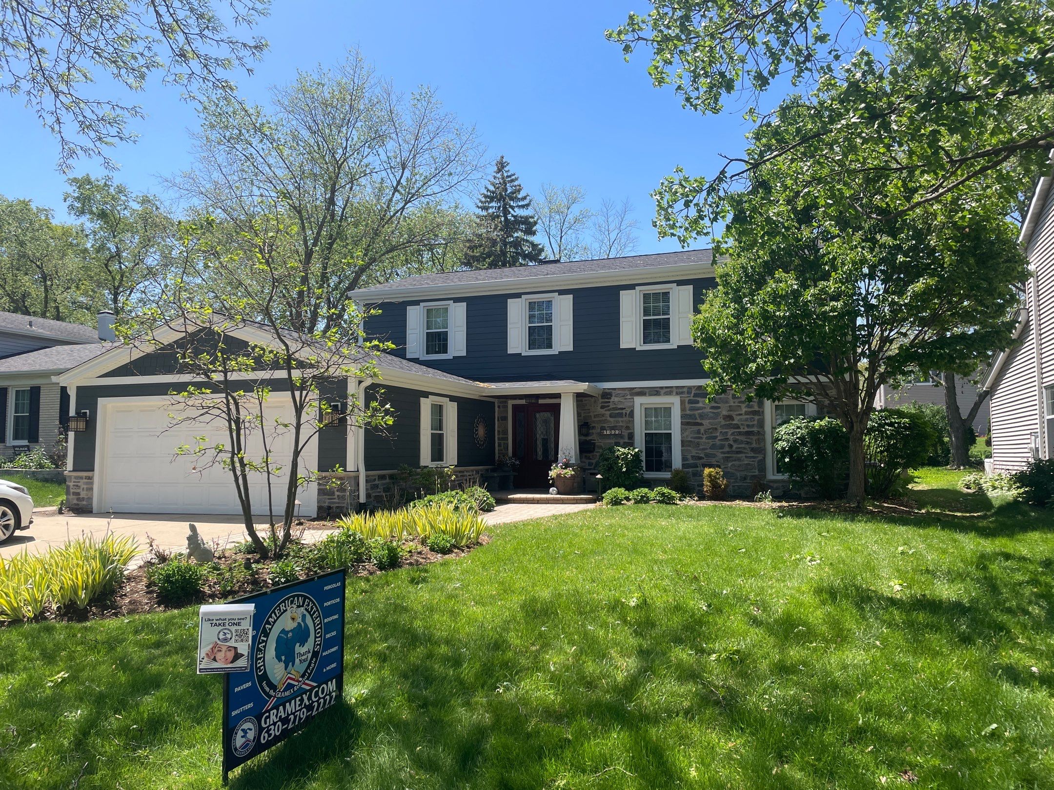 Exterior Renovation with James Hardie Siding and Natural Stone in Lombard by Great American Exteriors