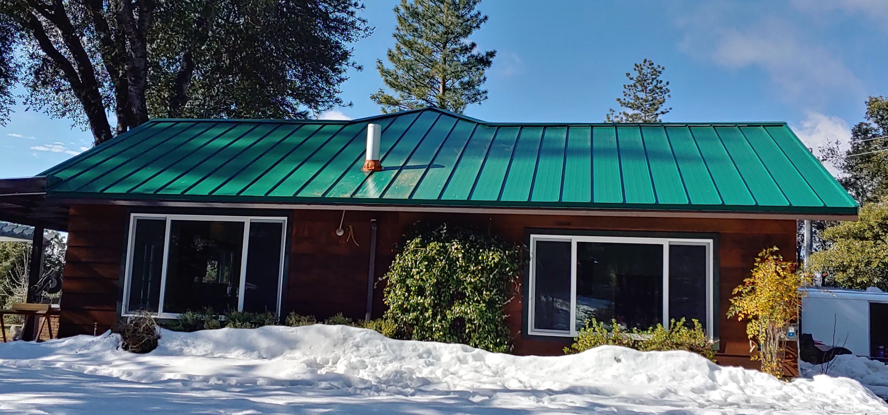 Metal roofing installation using Standing seam metal roofing system by Straight Edge Roofing Inc