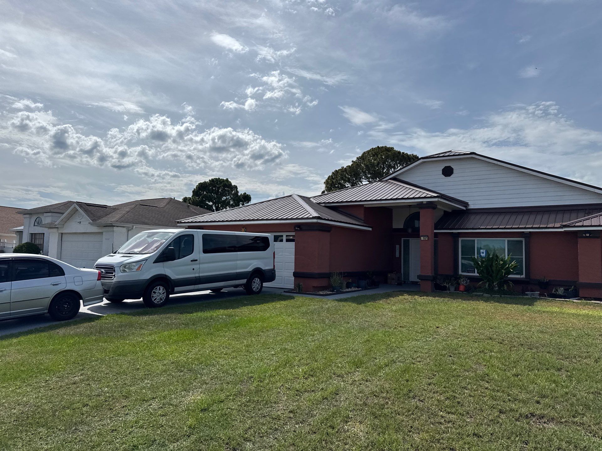 Residential Metal Roofing Installation and Gutter Replacement in Kissimmee by Pinnacle Roofing Group