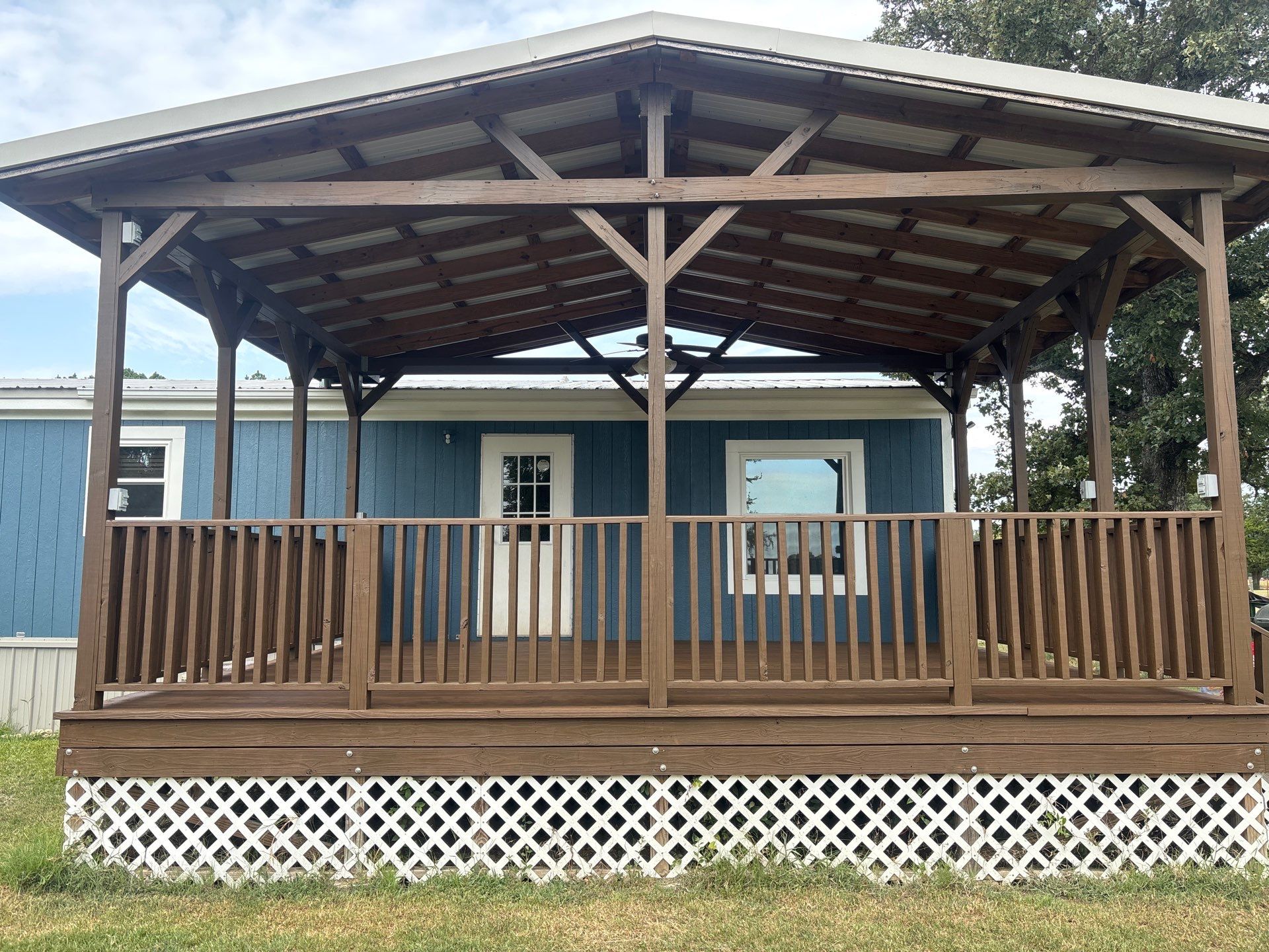 Exterior Painting in Fruitvale, TX | Wood Porch & Home in Deep Navy Blue by Quality Coats Painting