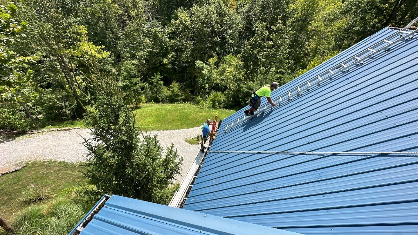Residential Roofing Installation using Standing Seam Metal - Gallery Blue by RoofX 