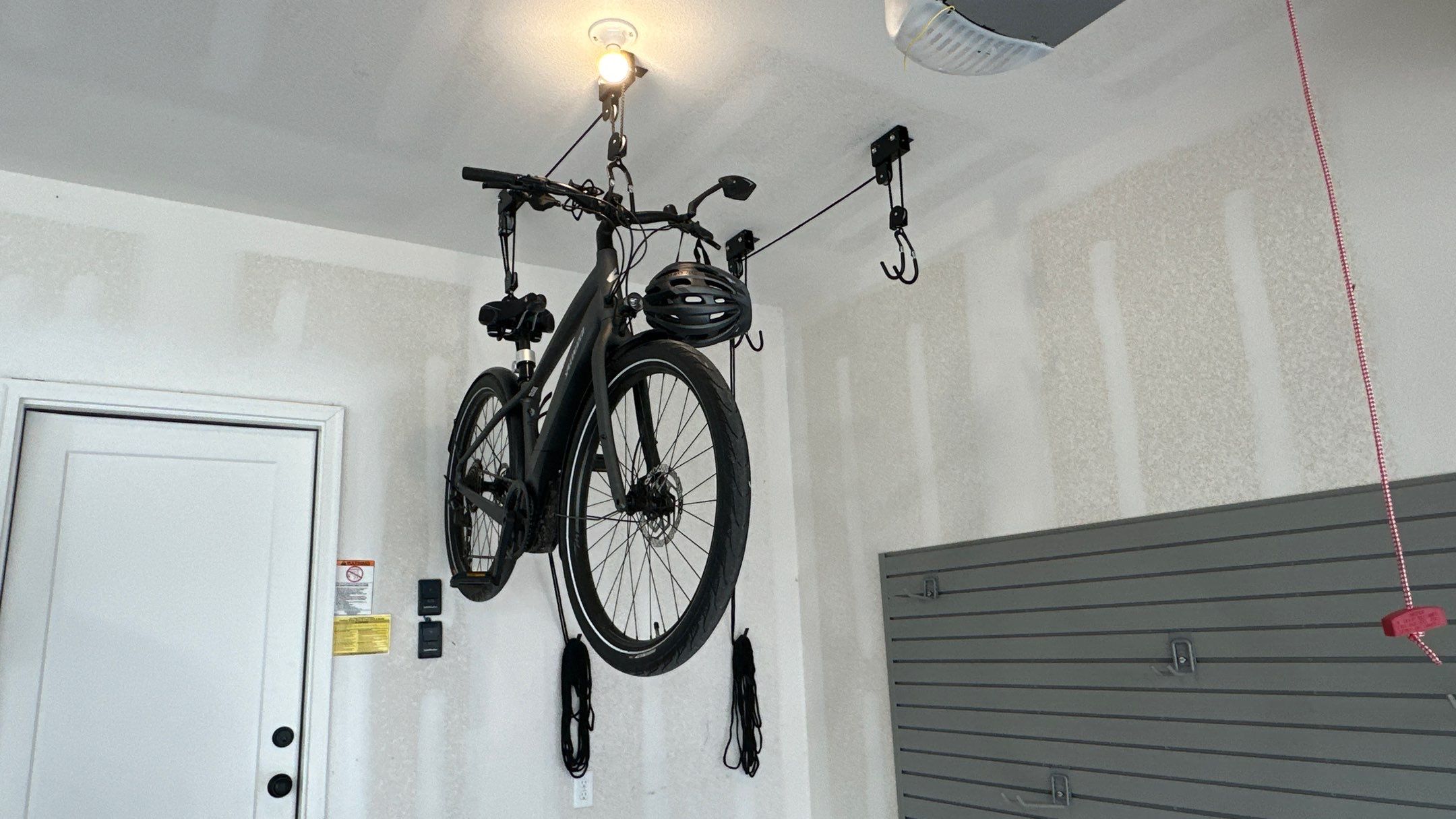 Jim H. added Slotwall and bike hoist to his garage by Banner Garage