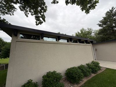 Exterior Trim Painting and Rafter Staining in Sioux Falls