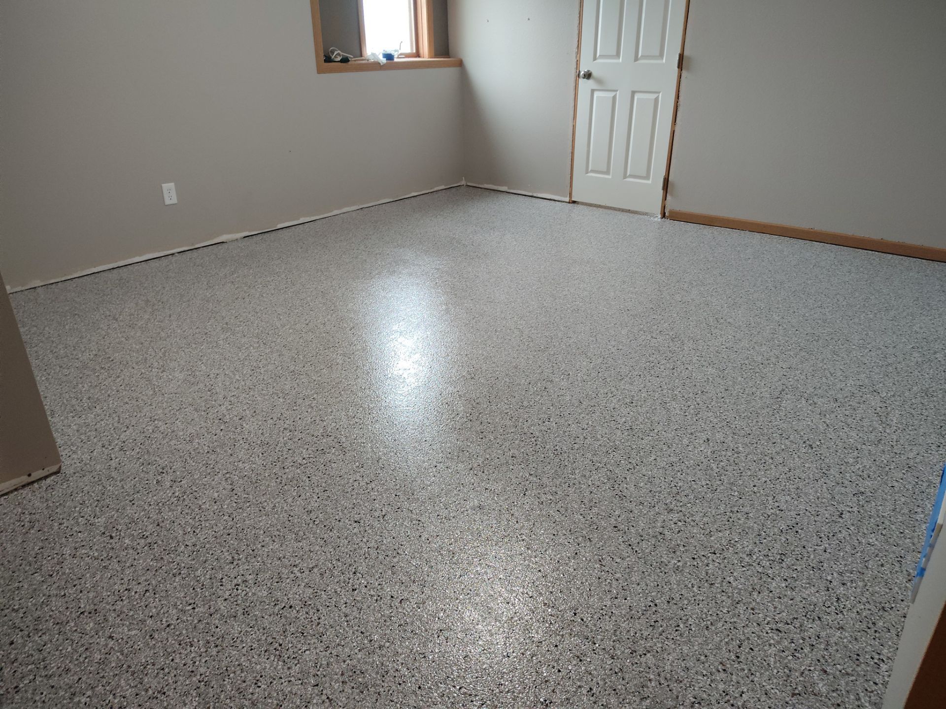 Maxwell, IA Coyote Flake Garage and Basement by Revival Concrete Coatings