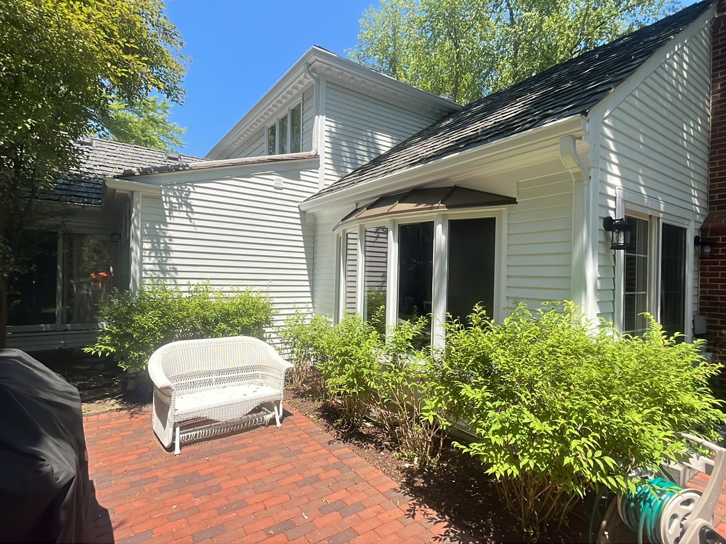 Housewashing  using Algaecide, soft wash soap by Northern Power Washing LLC.