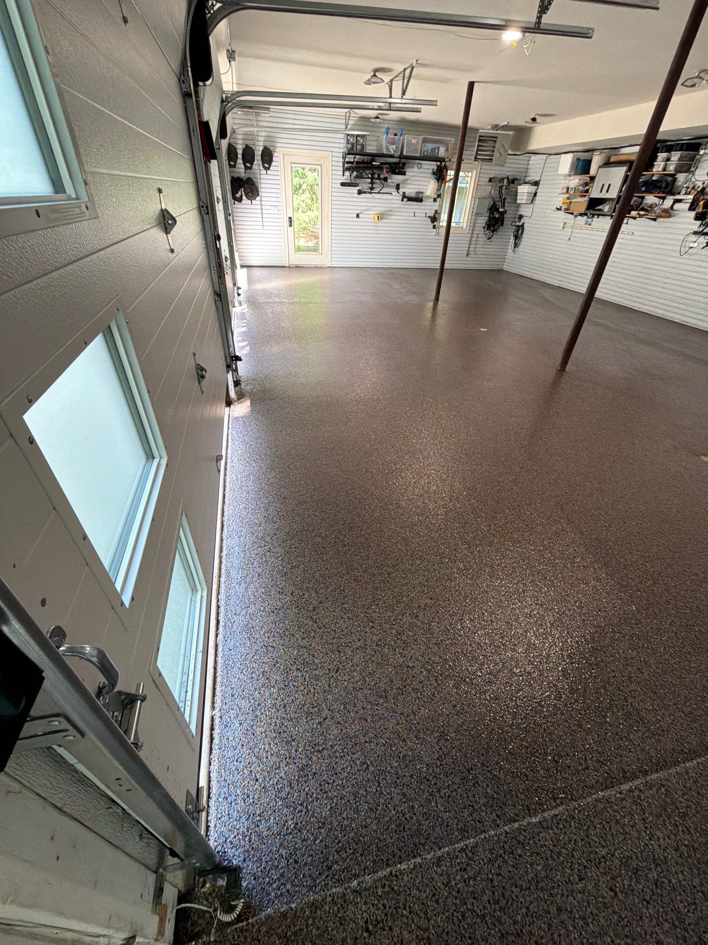 Residential Garage Epoxy Flake Floor Installation in Grand Haven by Gordon Painting