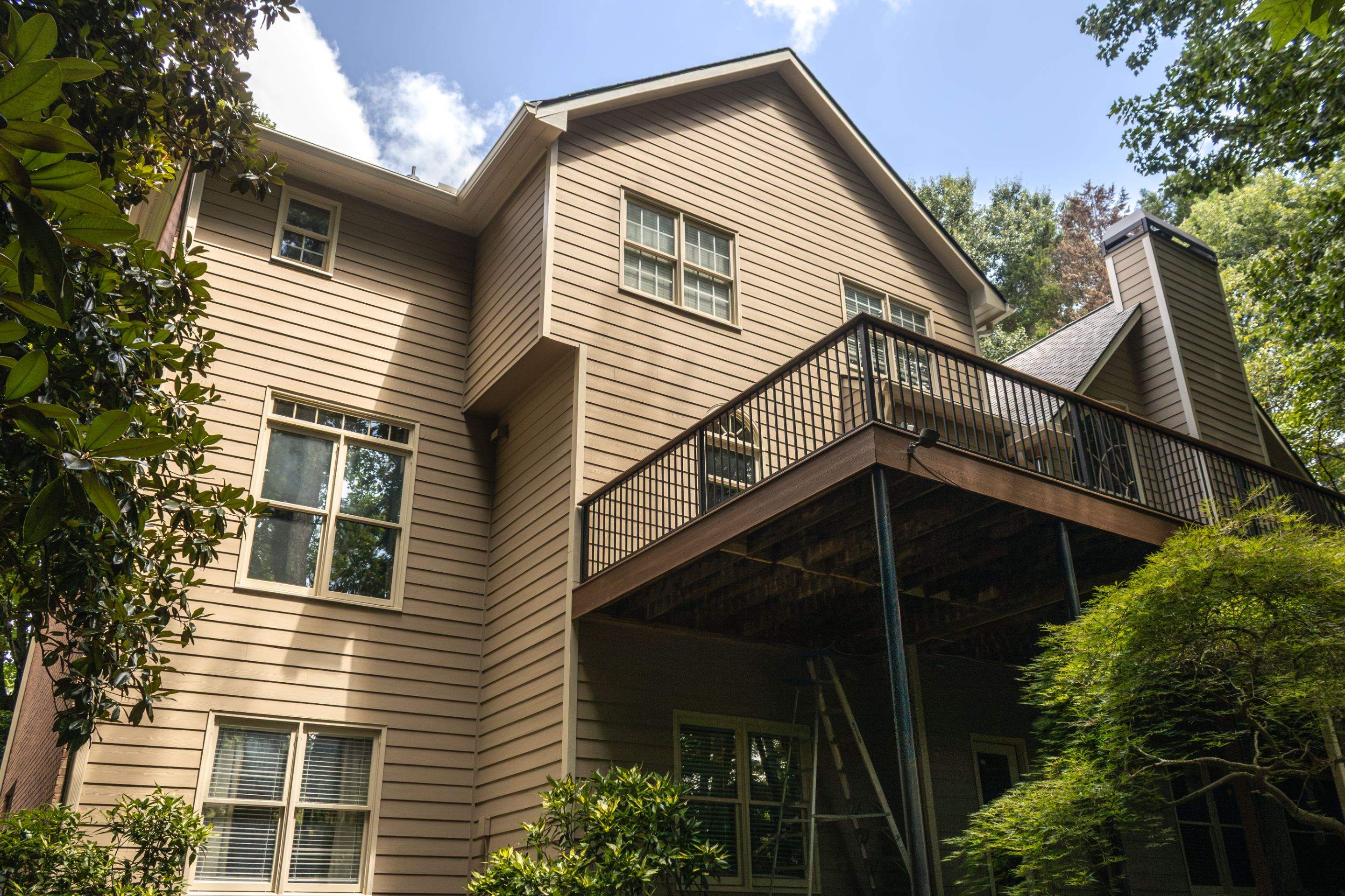 Full James Hardie Siding Replacement and Trex Deck Resurface in the Saddle Color by Nelson Exteriors 