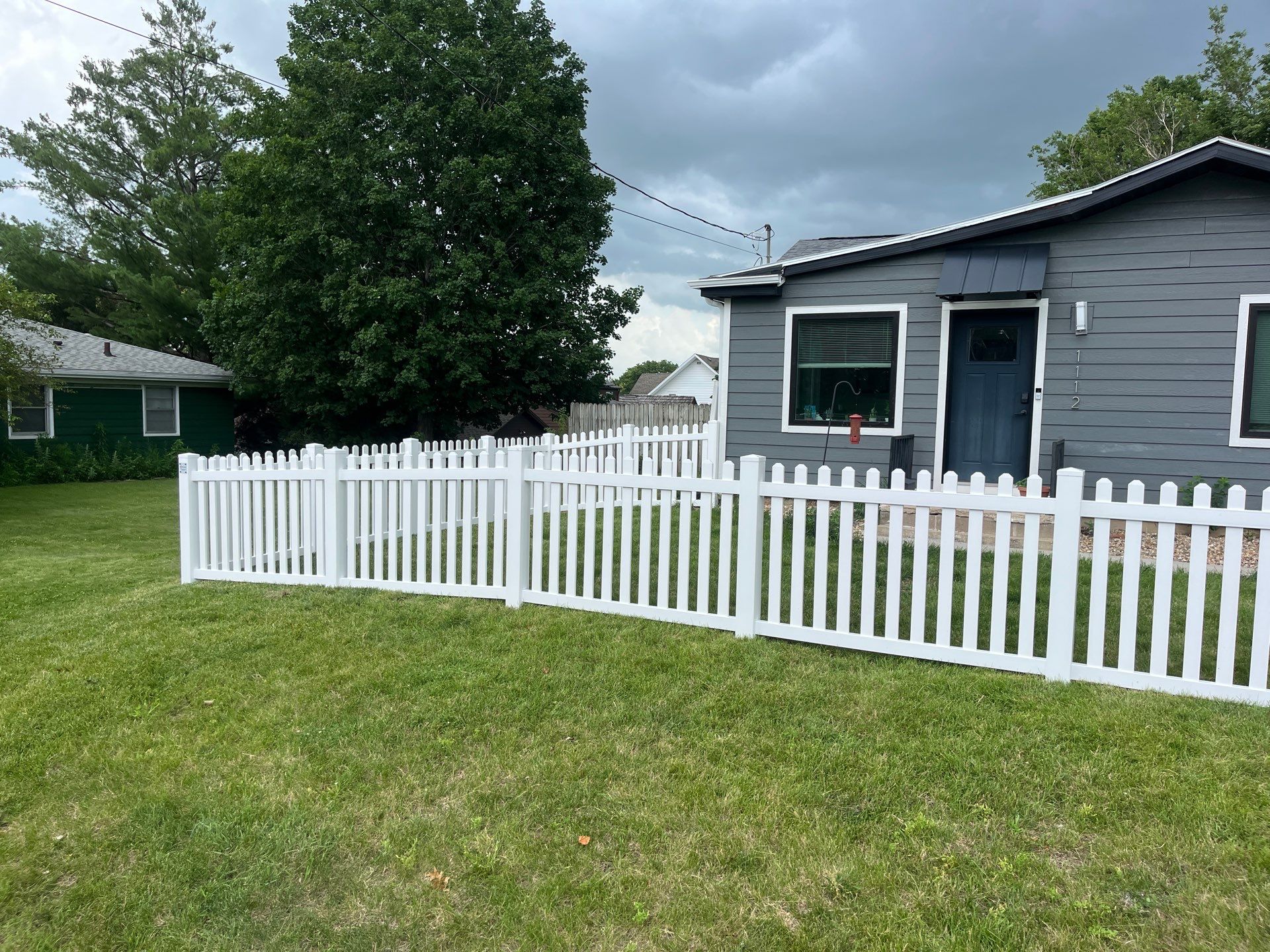 White Vinyl Spaced Picket Fence Installation in Cedar Falls by Perfect Picket Fence and Stain