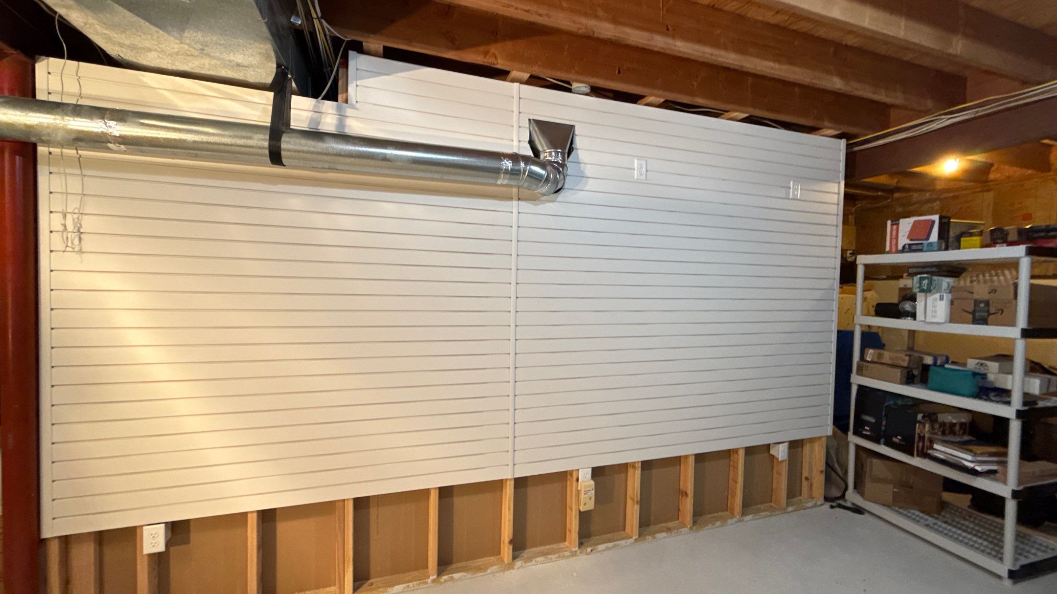 Garage Organization With Overhead Racks and Slatwall in Overland Park by Banner Garage
