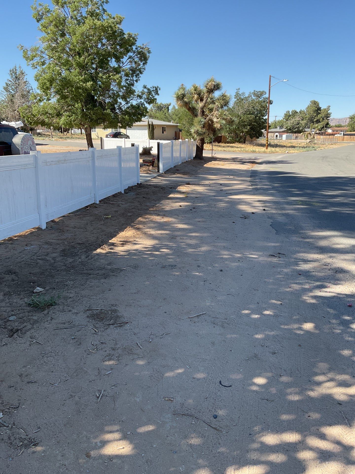 4ft White Vinyl Fence with Solar Power Motorized Gate by Fence Guys Inc.