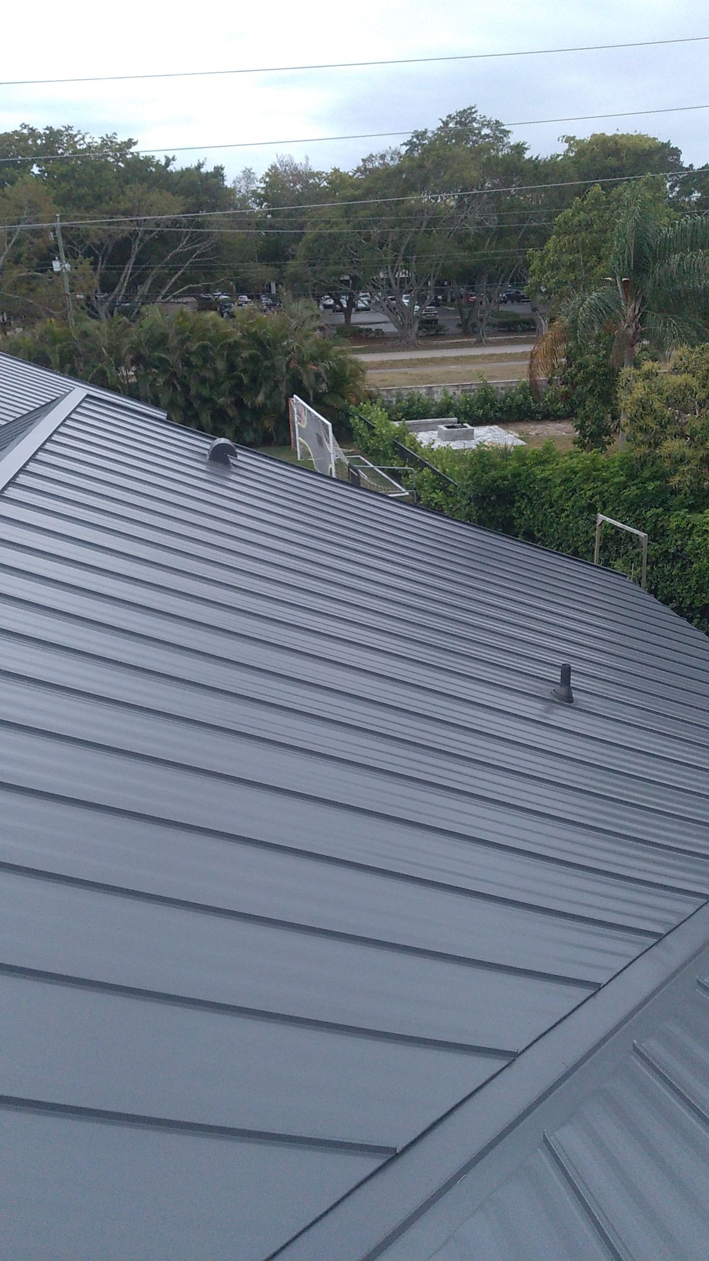 Residential Roofing Installation using 1" Nail strip metal roof by BLUES BROTHERS CONSTRUCTION CORP