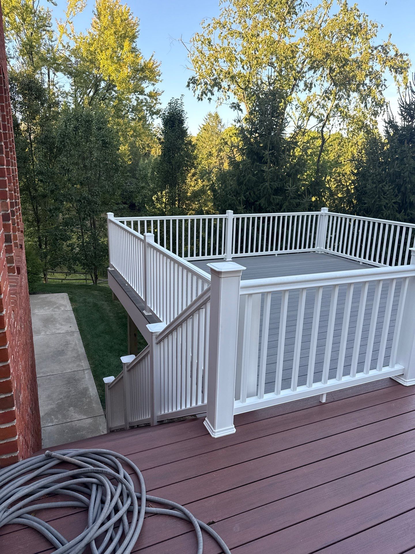 Deck extension  by Cousins Roofing Siding & Decks