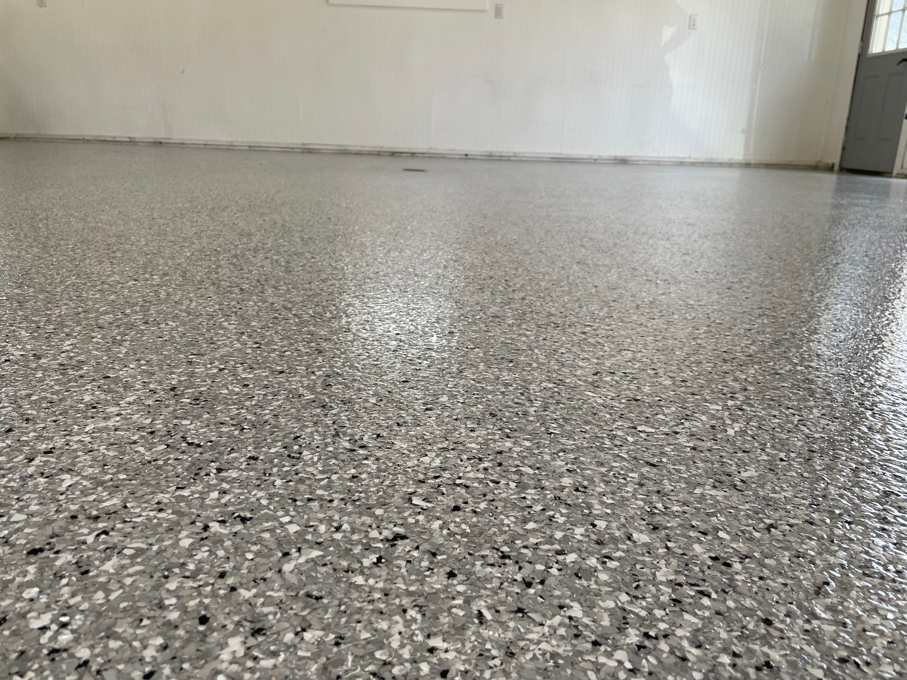 Feather Grey Garage Floor Coating and Crack Repair in Beresford by Select Painting, Coatings & Garage Cabinets