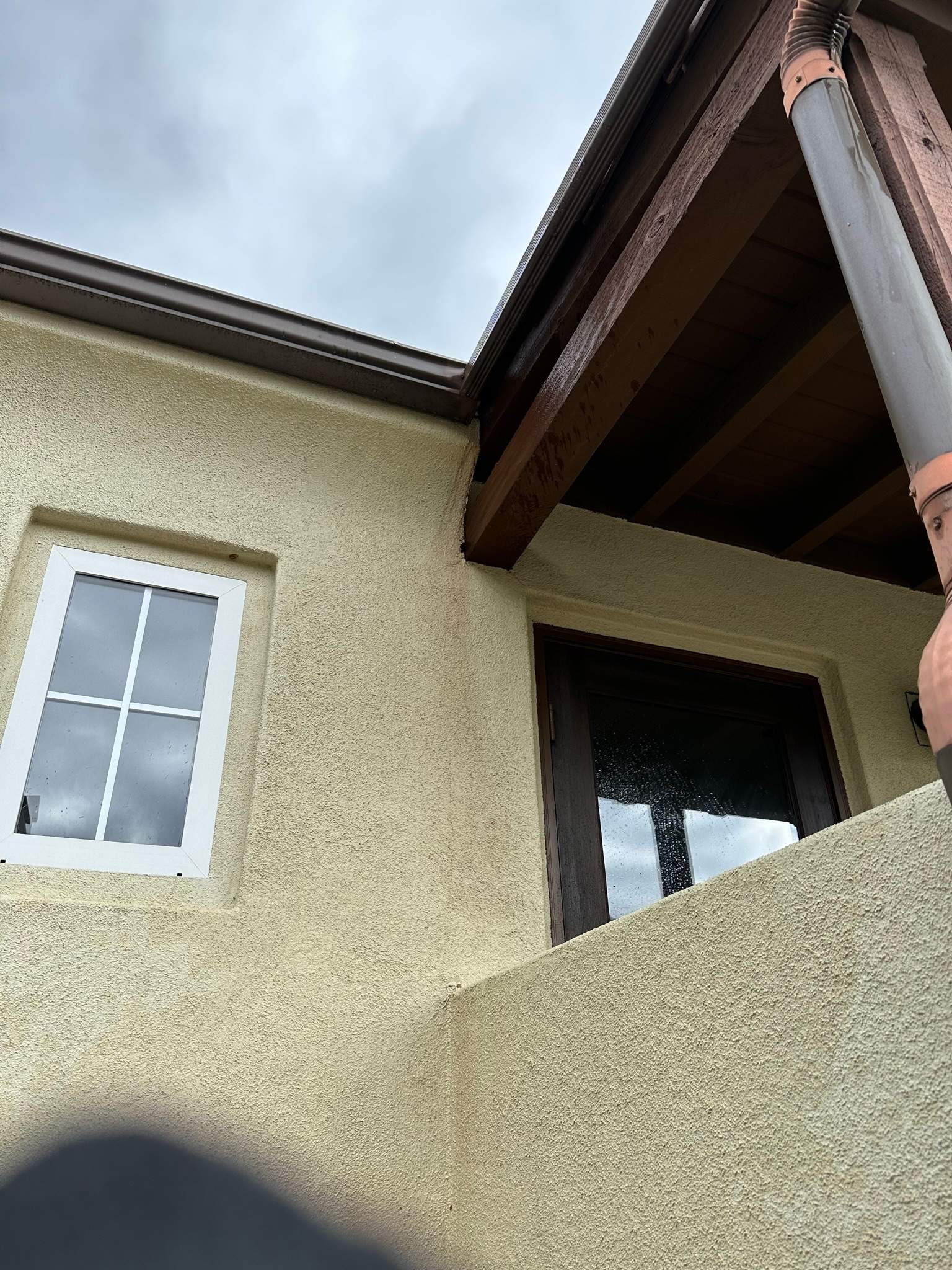 Clogged gutters at this Irvine home in Woodbury by Property Cleaning Experts, LLC