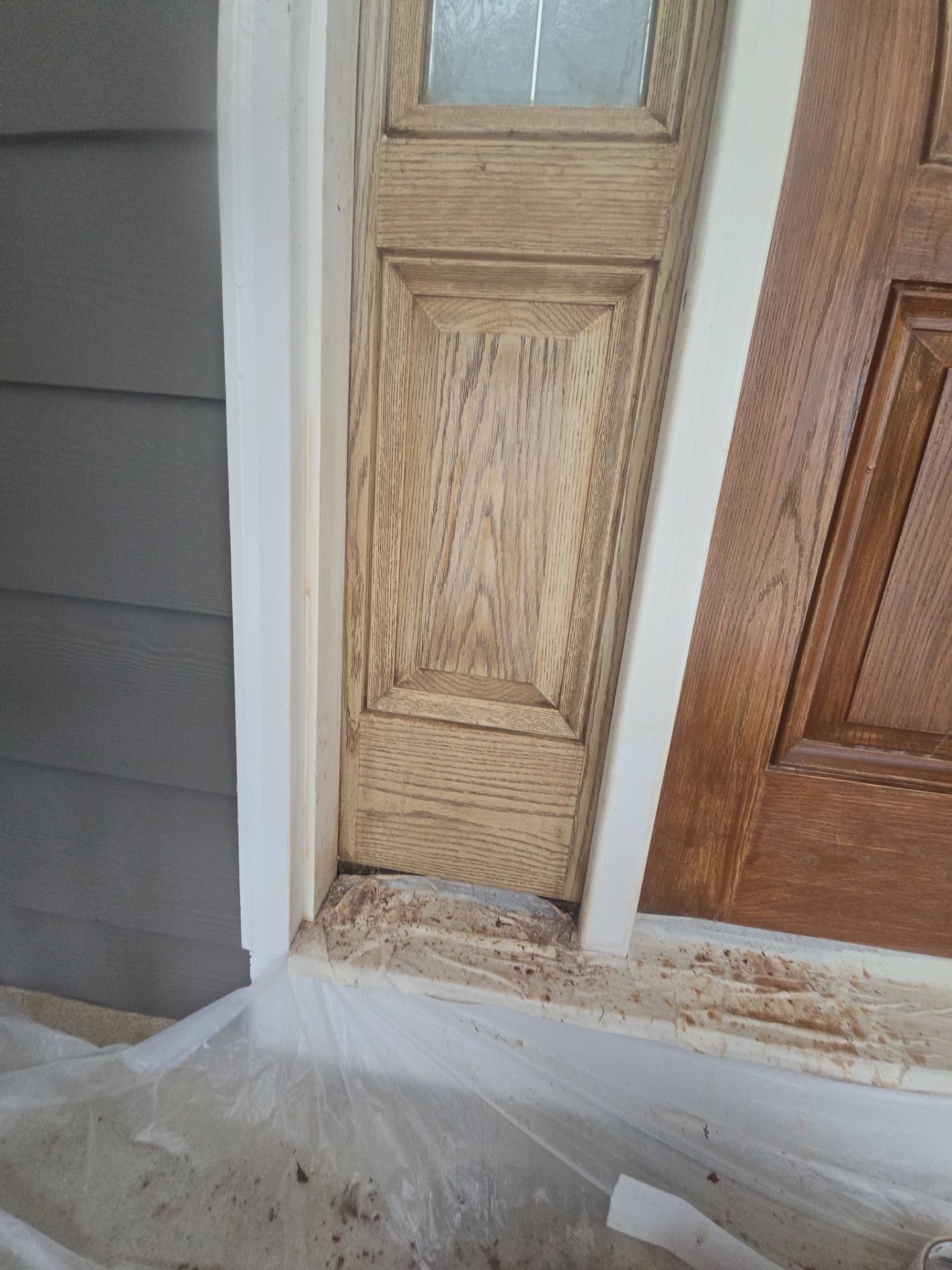 Siding replacement, exterior painting, and front door staining. by GonzalezPainters & Contractors Inc