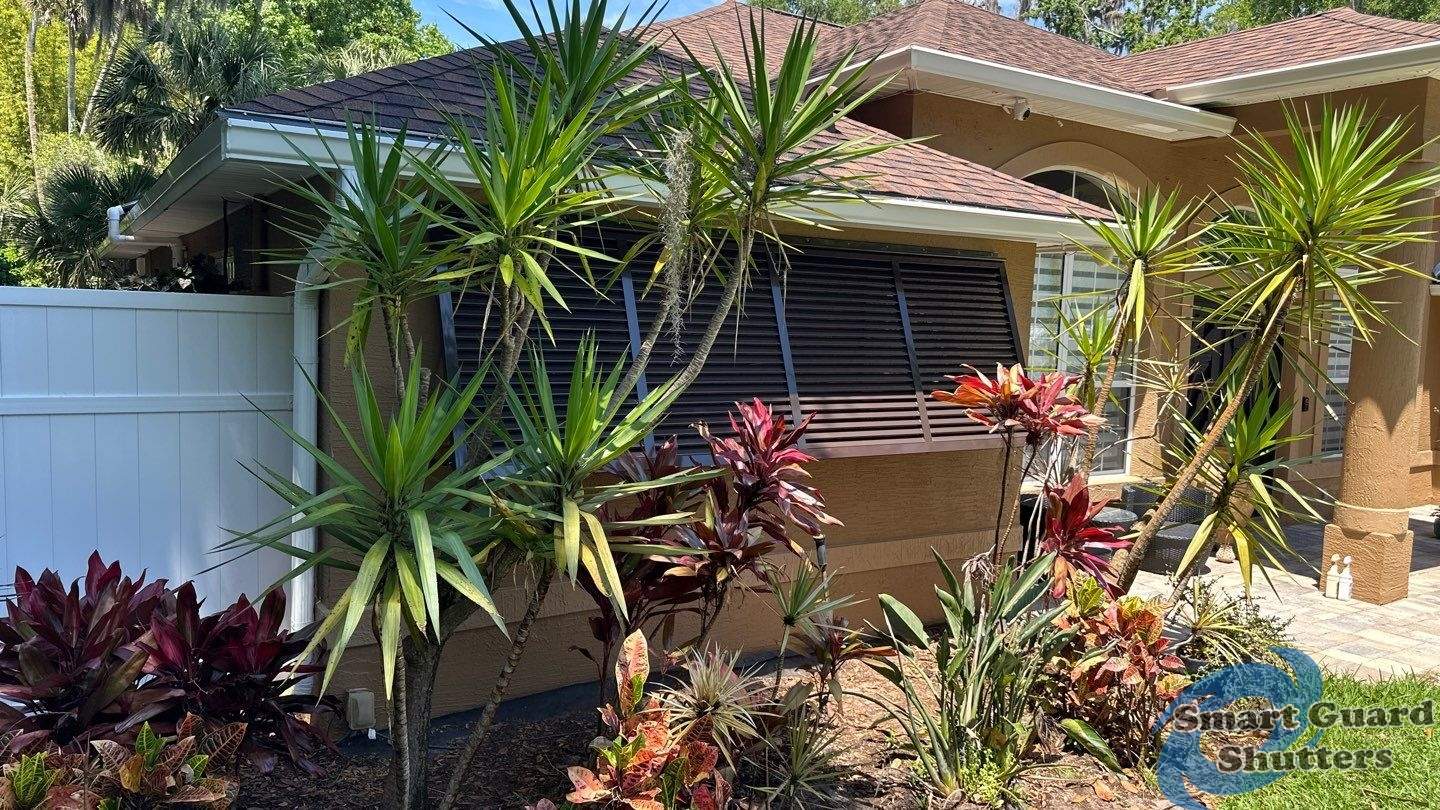 Decorative Bahama Shutter in Grey Brown by Smart Guard Shutters