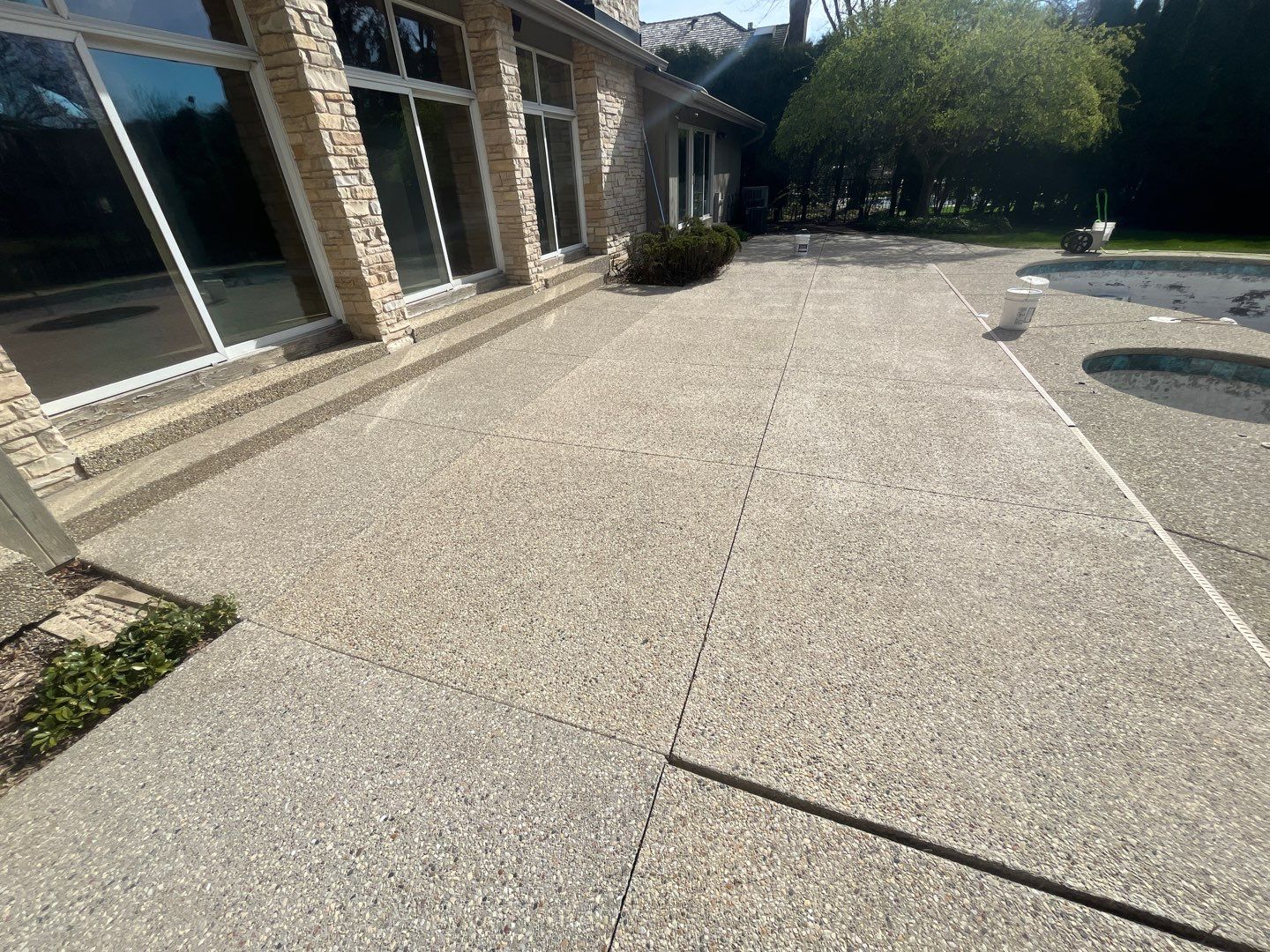 Aggregate Clean and seal using low gloss sealer by Northern Power Washing LLC.