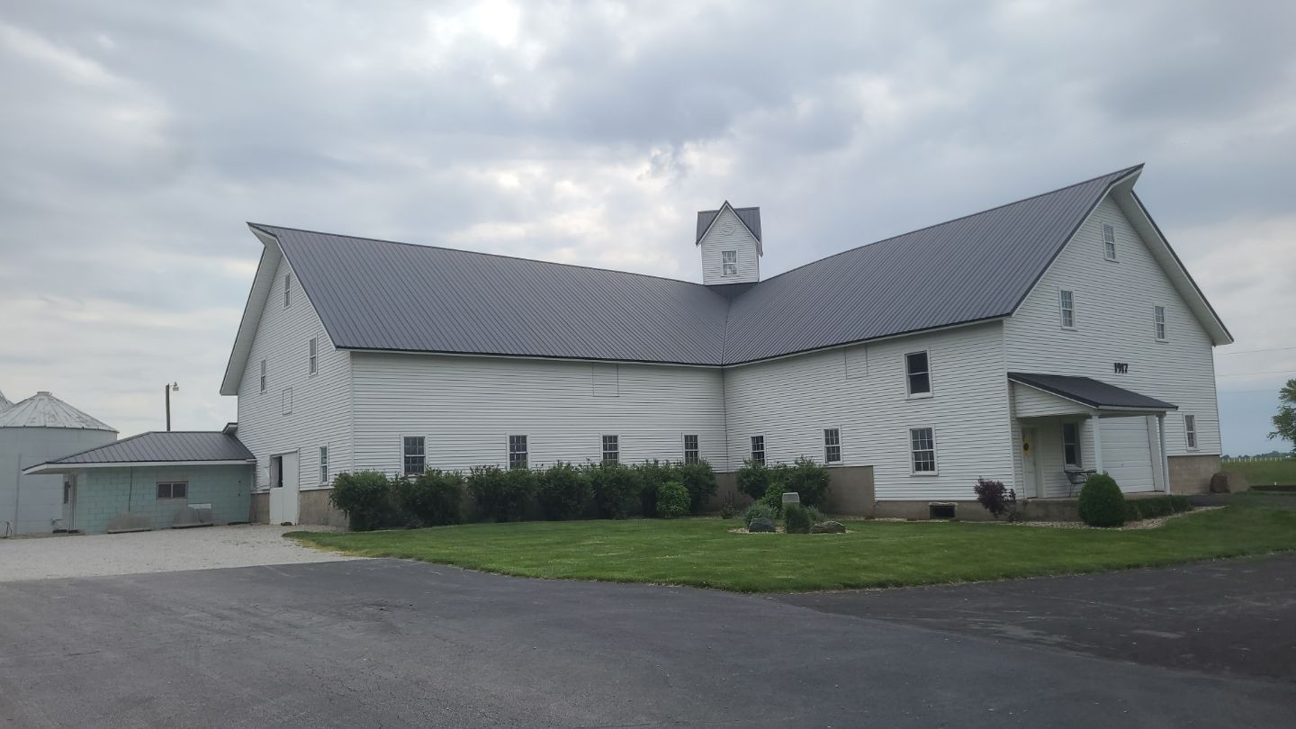 New metal roof on heirloom barn by Dagny Builders