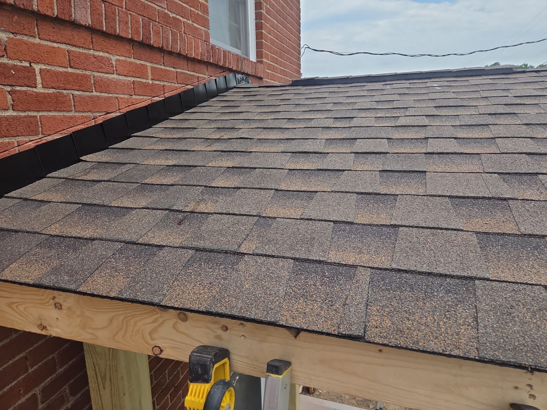 Concret and roof build  by Cousins Roofing Siding & Decks