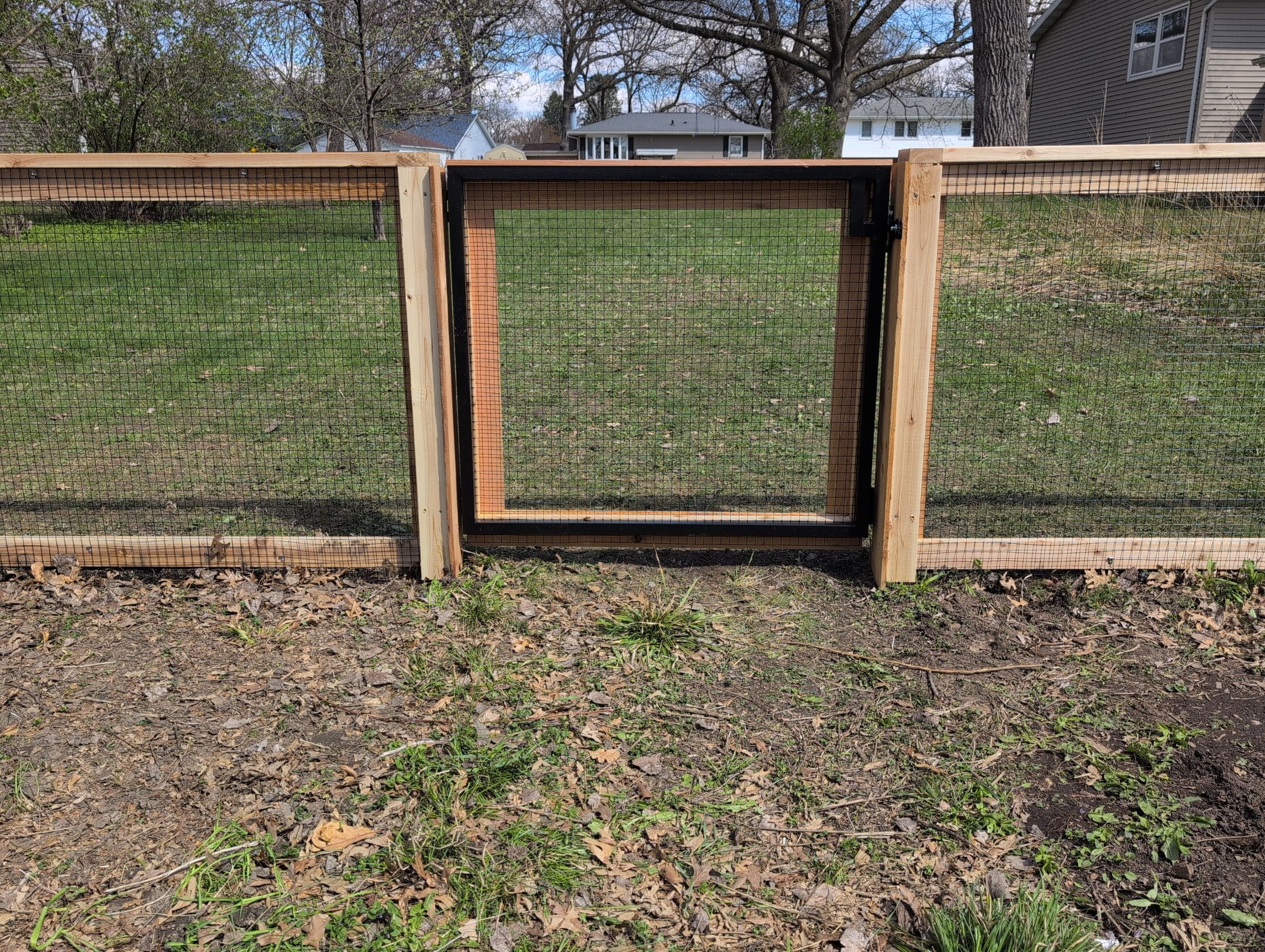 Custom Cedar Wood Garden Fence Installation in Cedar Falls by Perfect Picket Fence and Stain