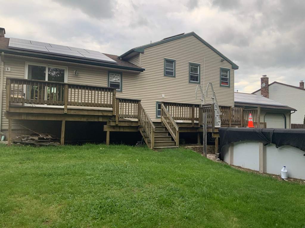 Replacement pool deck with Trex Lineage Carmel and Transcend railings by DiGiorgi Roofing and Siding Inc