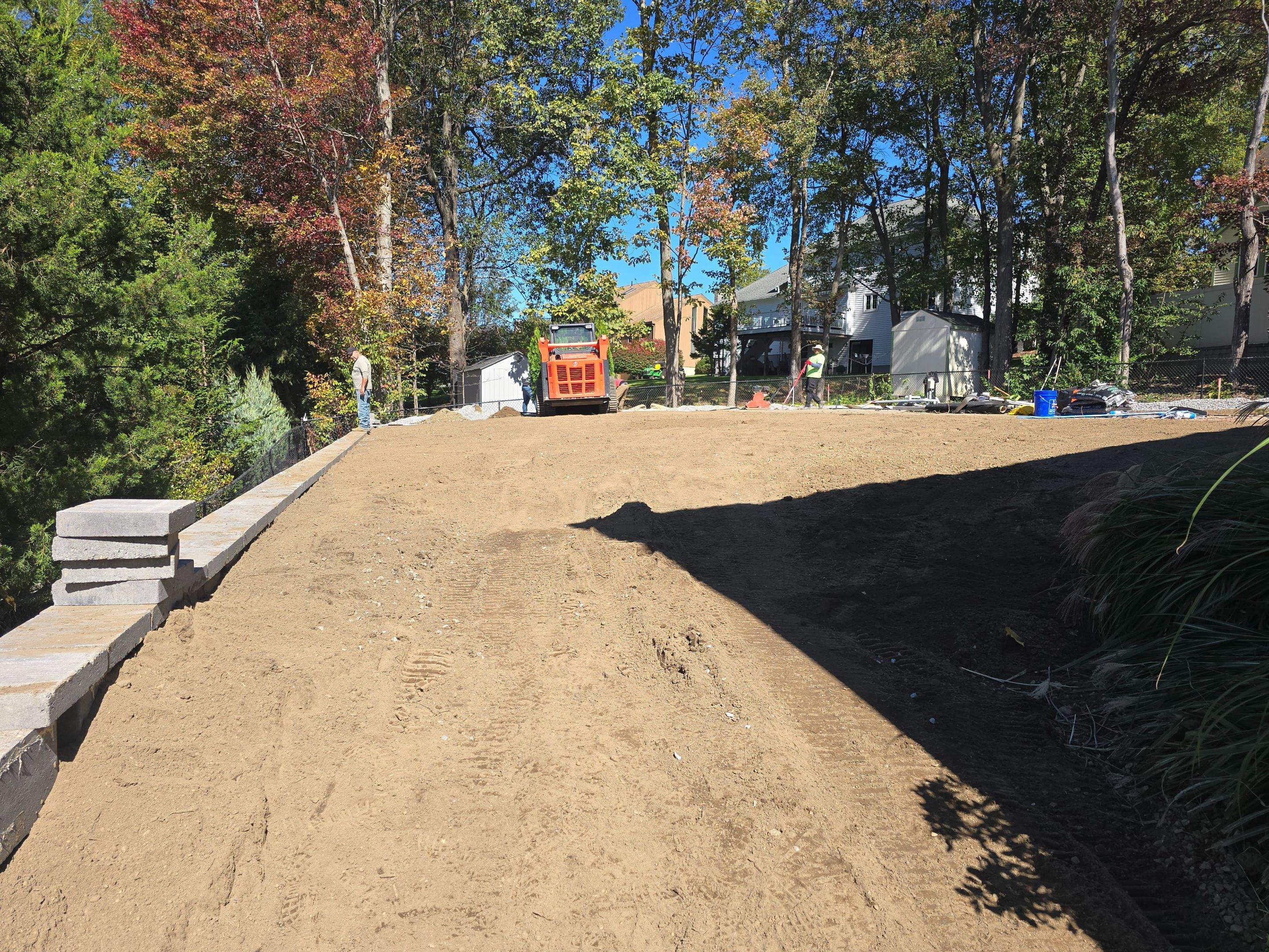 Retaining Wall to Level Backyard  by May Property Management 