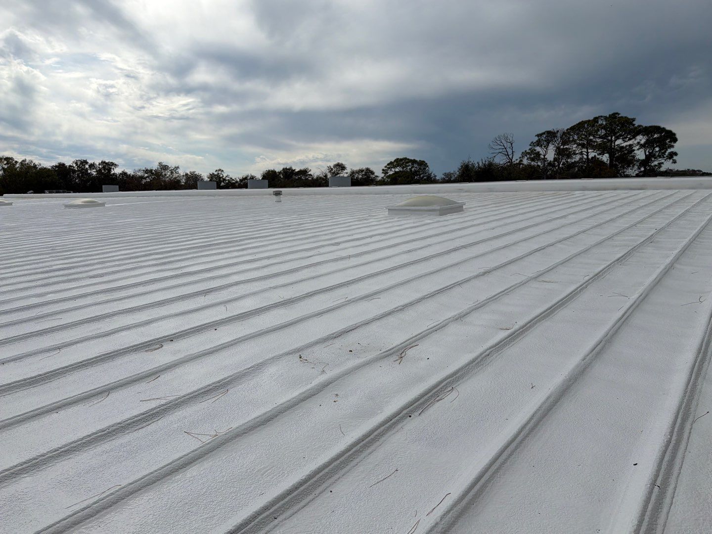 Sarasota Industrial Warehouse Metal Roof Silicone Coating Restoration by CES Roofing