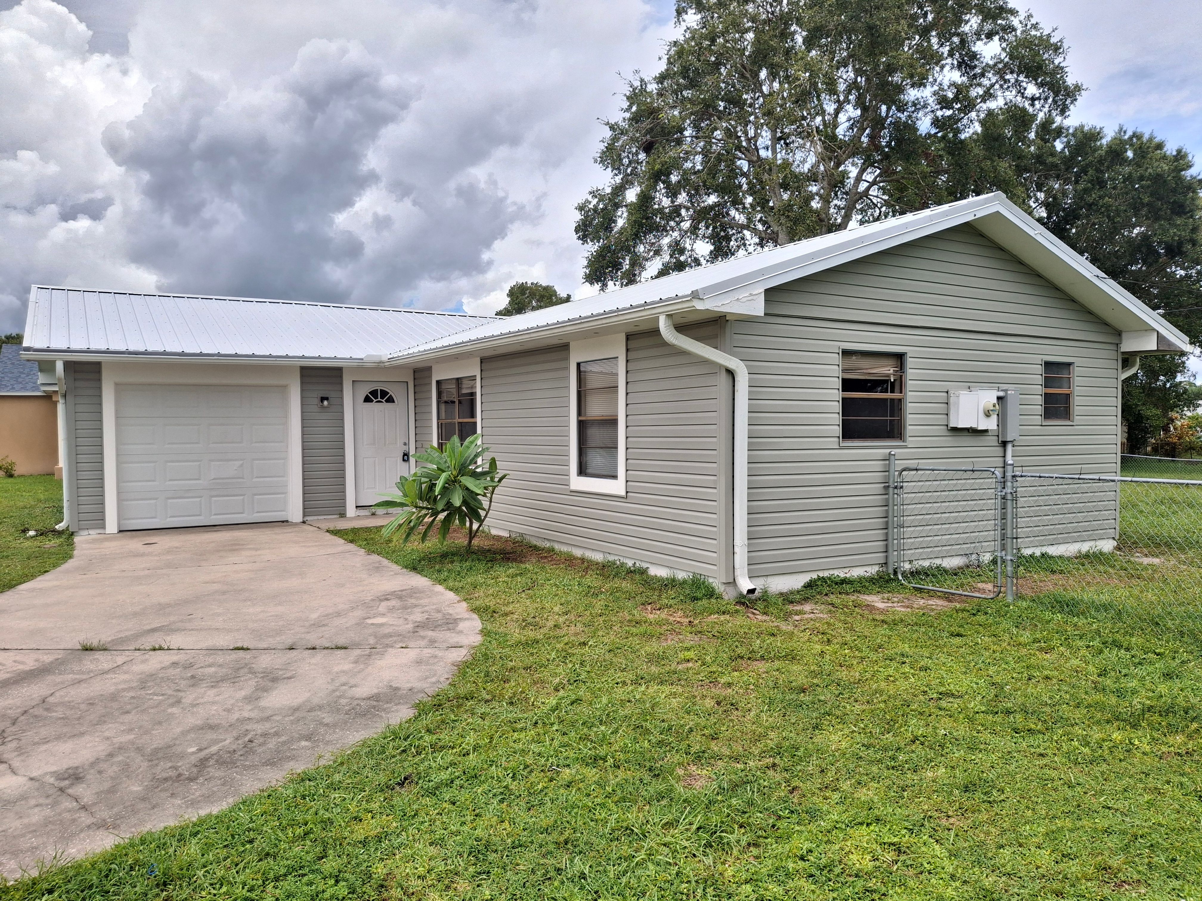 Vinyl Siding Installation and Structural Wood Rot Repair in Palm Bay by Florida Roofing and Renovations Inc.