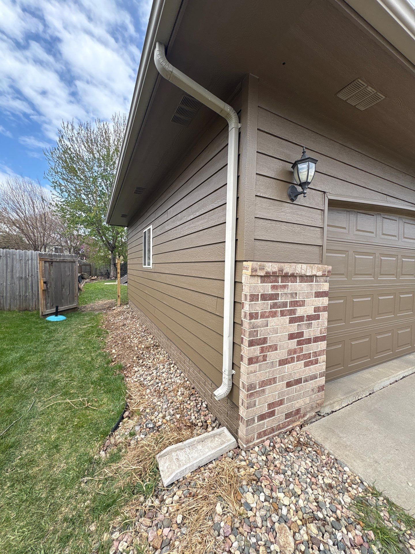 Exterior Painting and Wood Trim Replacement in Sioux Falls by Select Painting, Coatings & Garage Cabinets