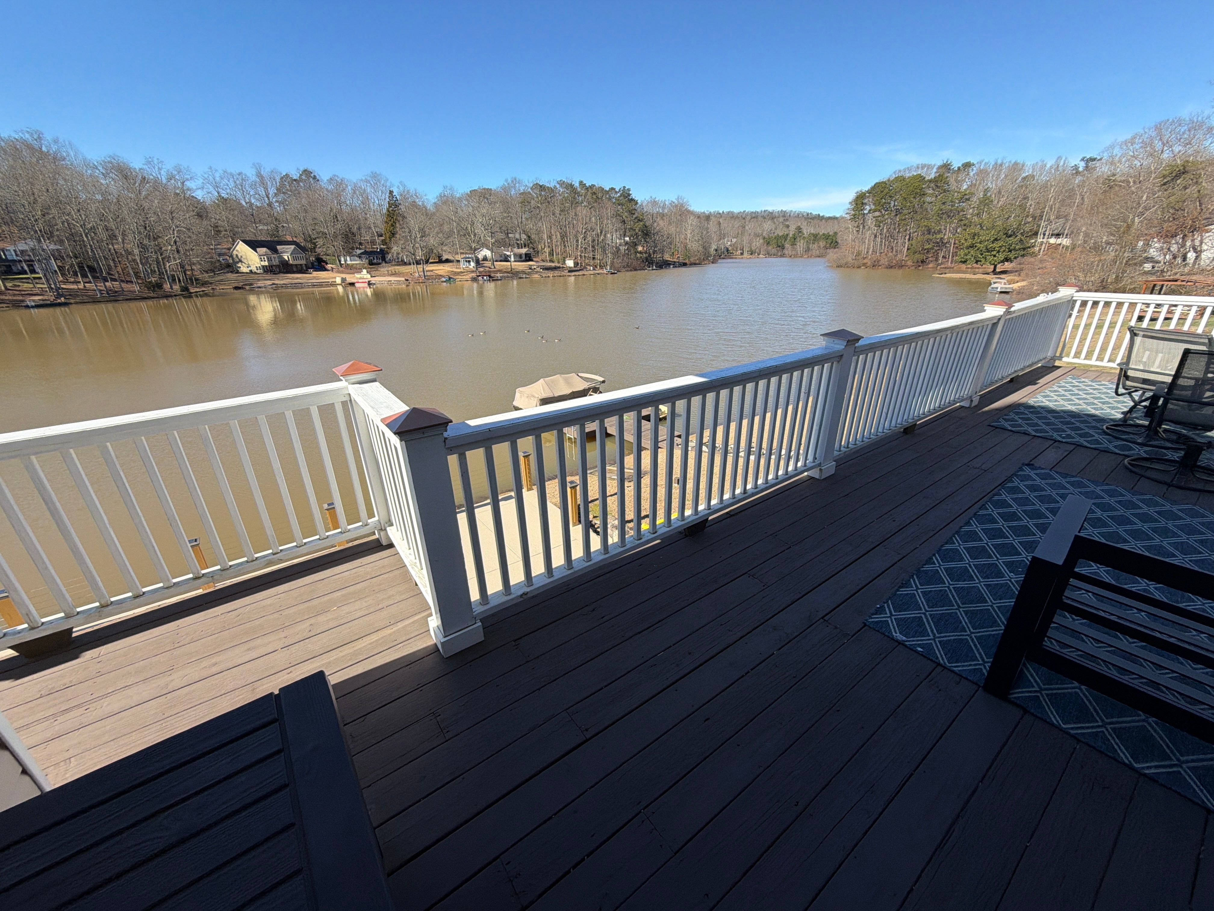 Cumming, GA Lake House Deck Resurface and Extension using Pressure Treated Pine and Skyline Cable Railing by Nelson Exteriors 