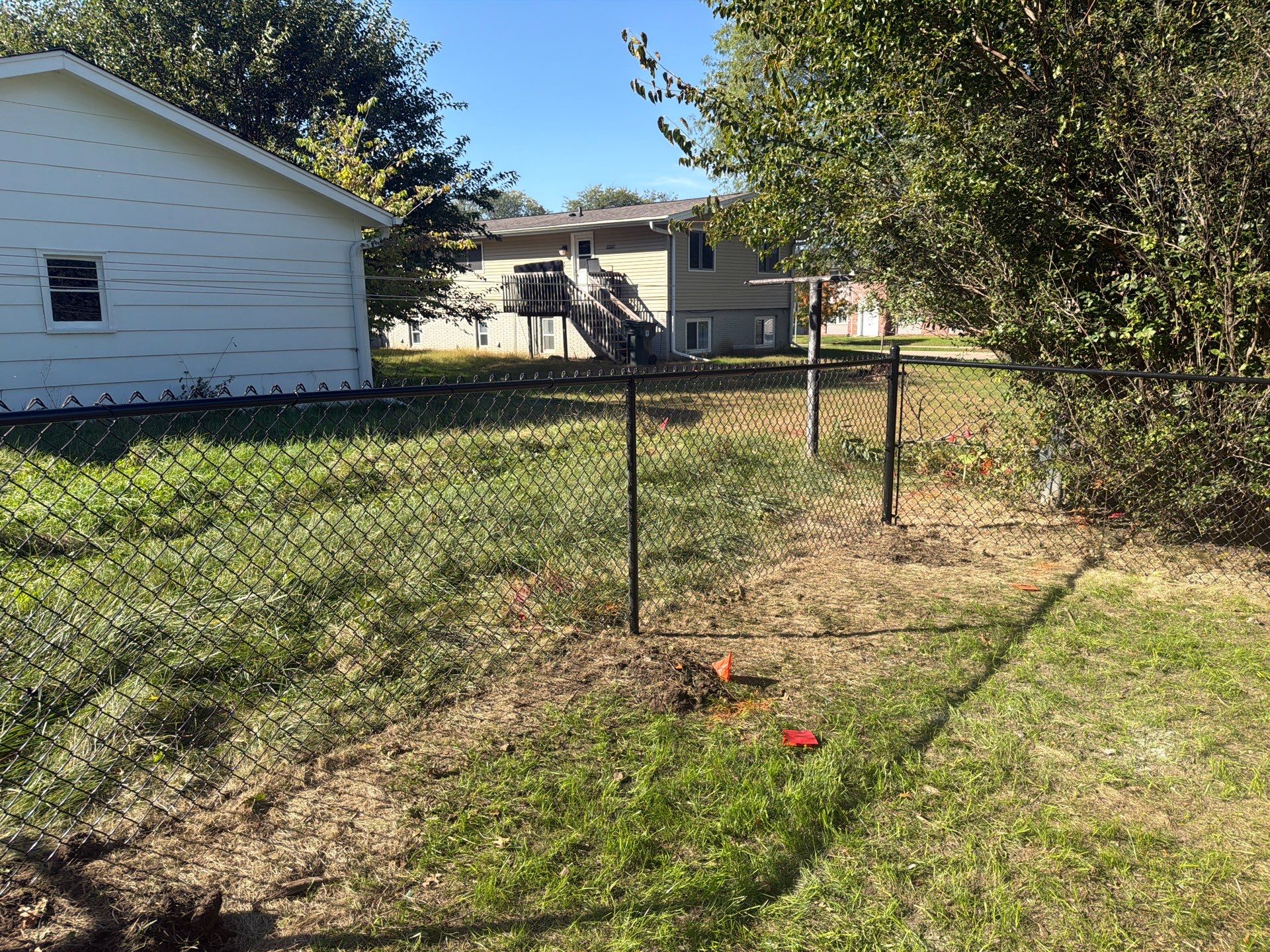 Black Chain Link Fence Installation with Double Gate in Cedar Falls by Perfect Picket Fence and Stain