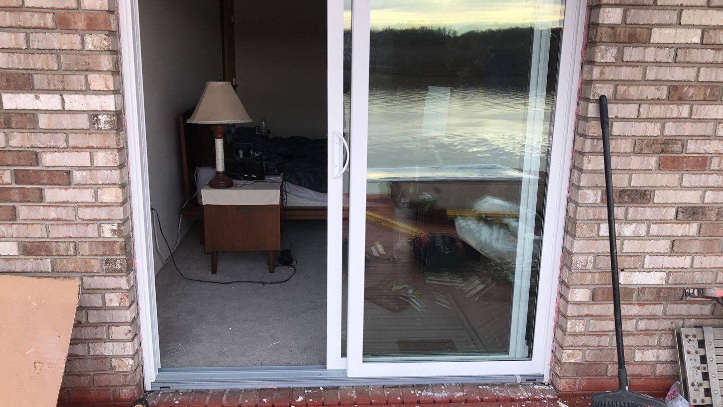 Deck Refurbush and Door Replacement using Trex Decking and Railing. Polaris Patio Doors by Secure Construction Company Inc