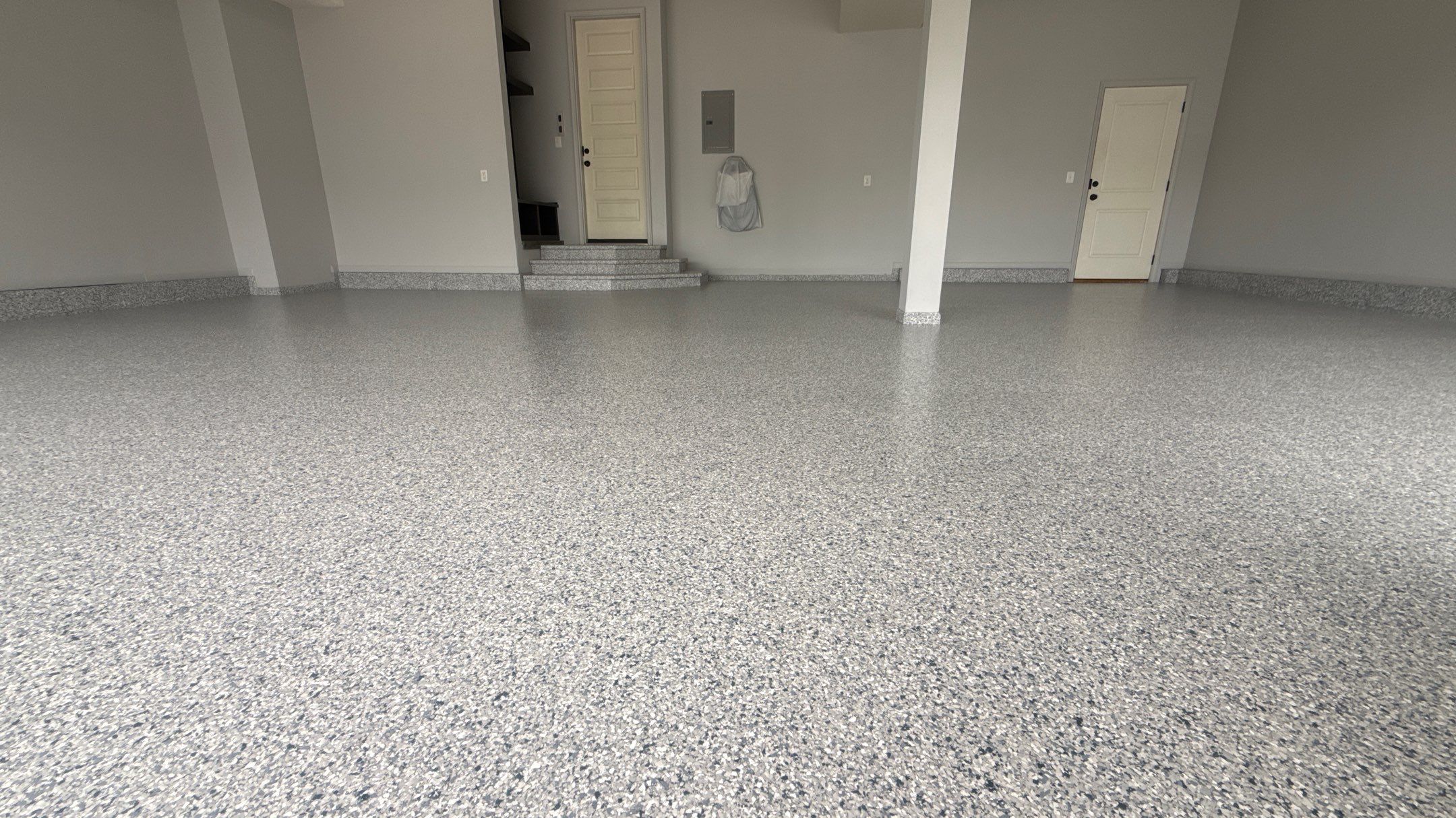 Comprehensive Garage Renovation Featuring Epoxy Flooring and Custom Storage in Shawnee by Banner Garage