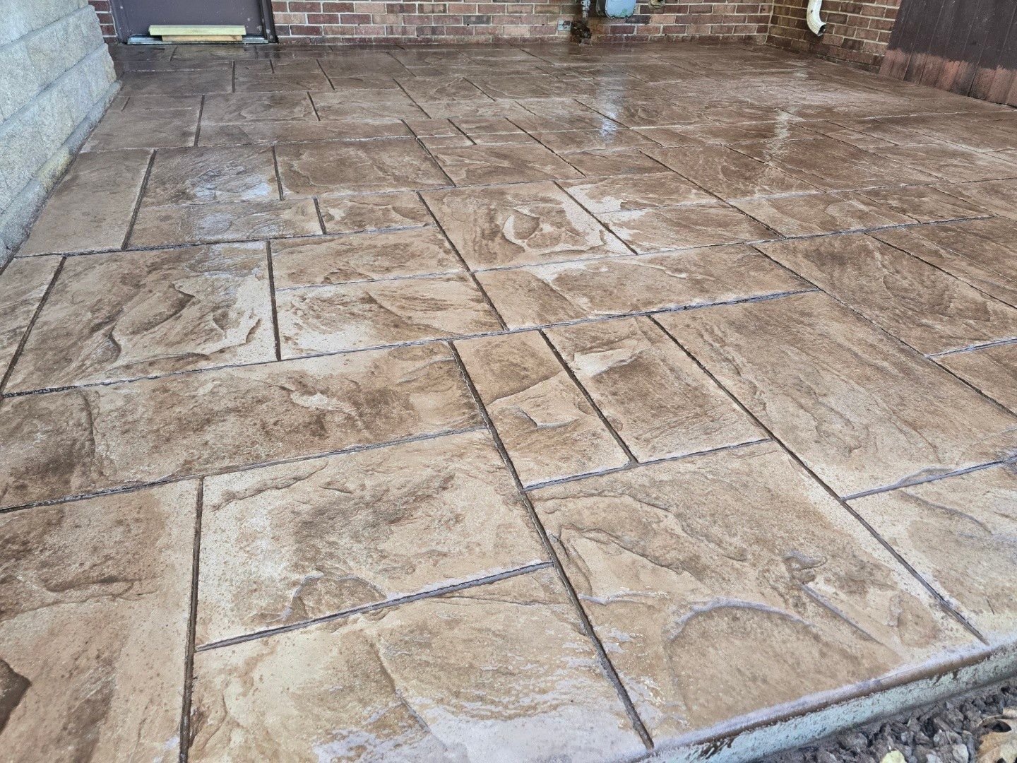 Stamped concrete and redeck  by Cousins Roofing Siding & Decks