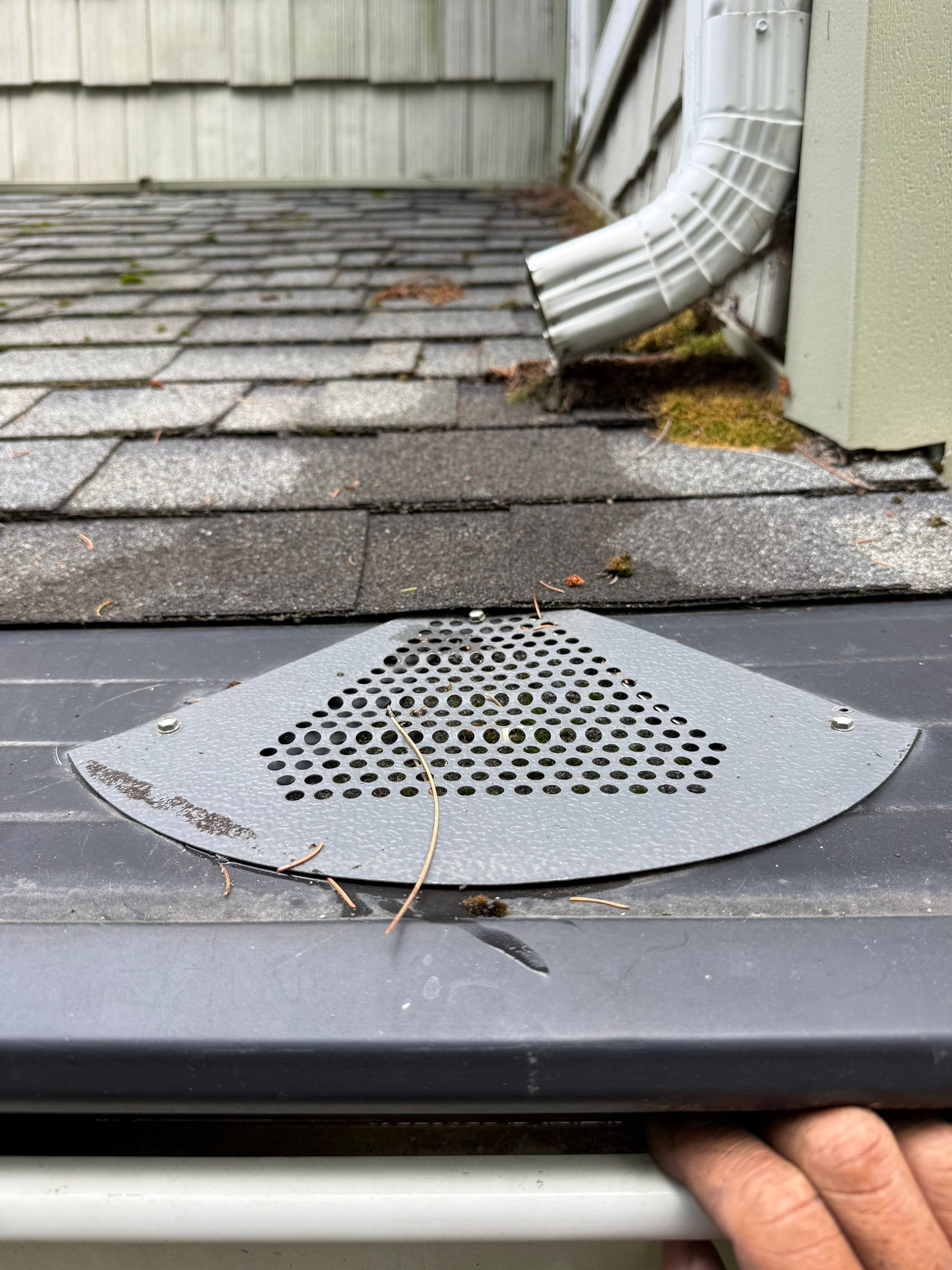 Gutter Helmet Protection System for Suttons Bay Home with Cedar Siding by Rainbow Seamless Systems