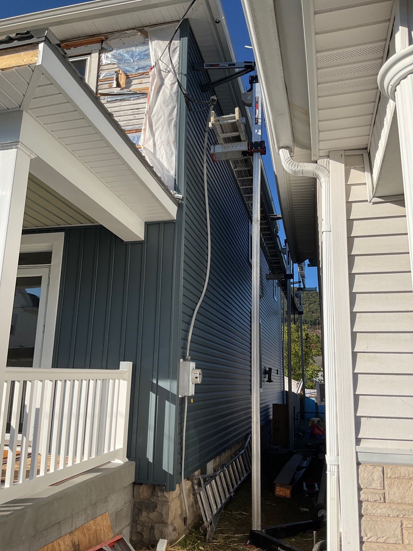 Charcoal Metal Roof & Blue Siding — A Refreshing New Look by Esh Builders