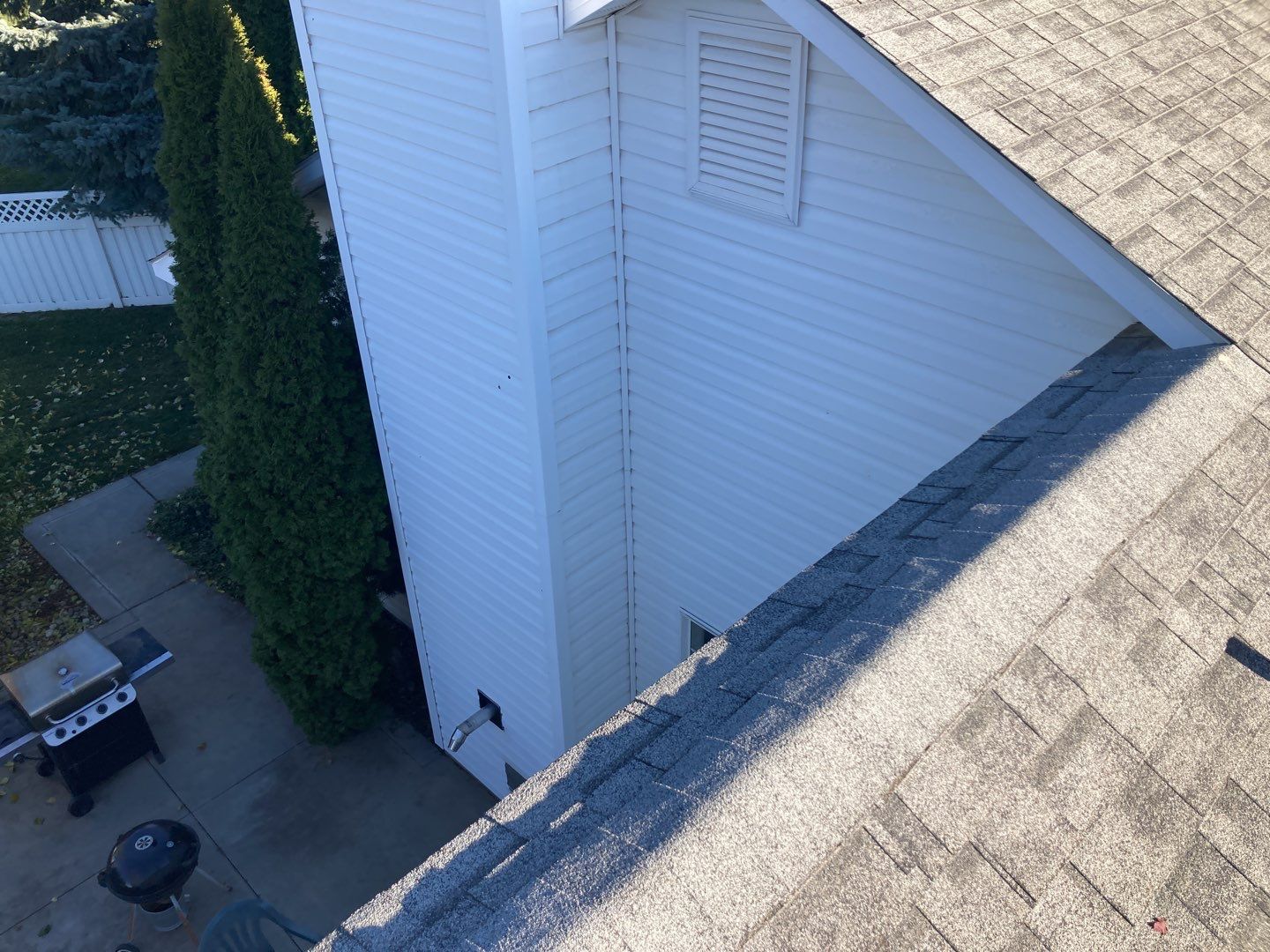 Two story farmhouse style roofing installation using Owens Corning Duration in the color Teak by ID Roofing LLC