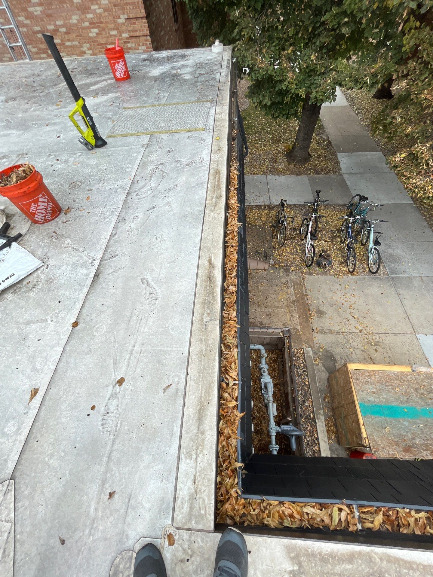 Commercial gutter cleaning Fort Collins / Loveland before photo with filled gutters