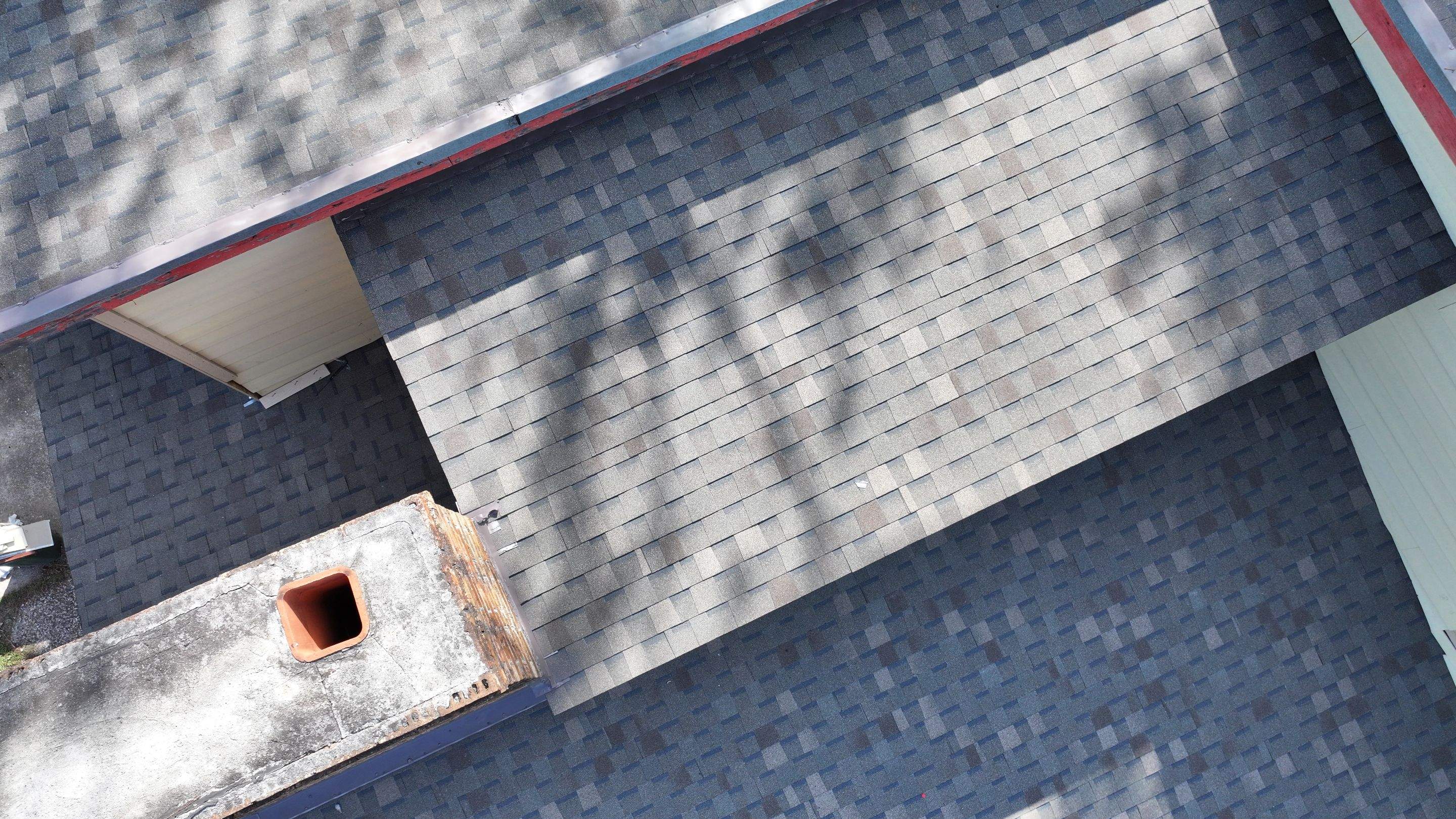 Roof Replacement with Chimney Flashing Detail — Houston, TX by PL Roofing & SB Roofing, LLC.