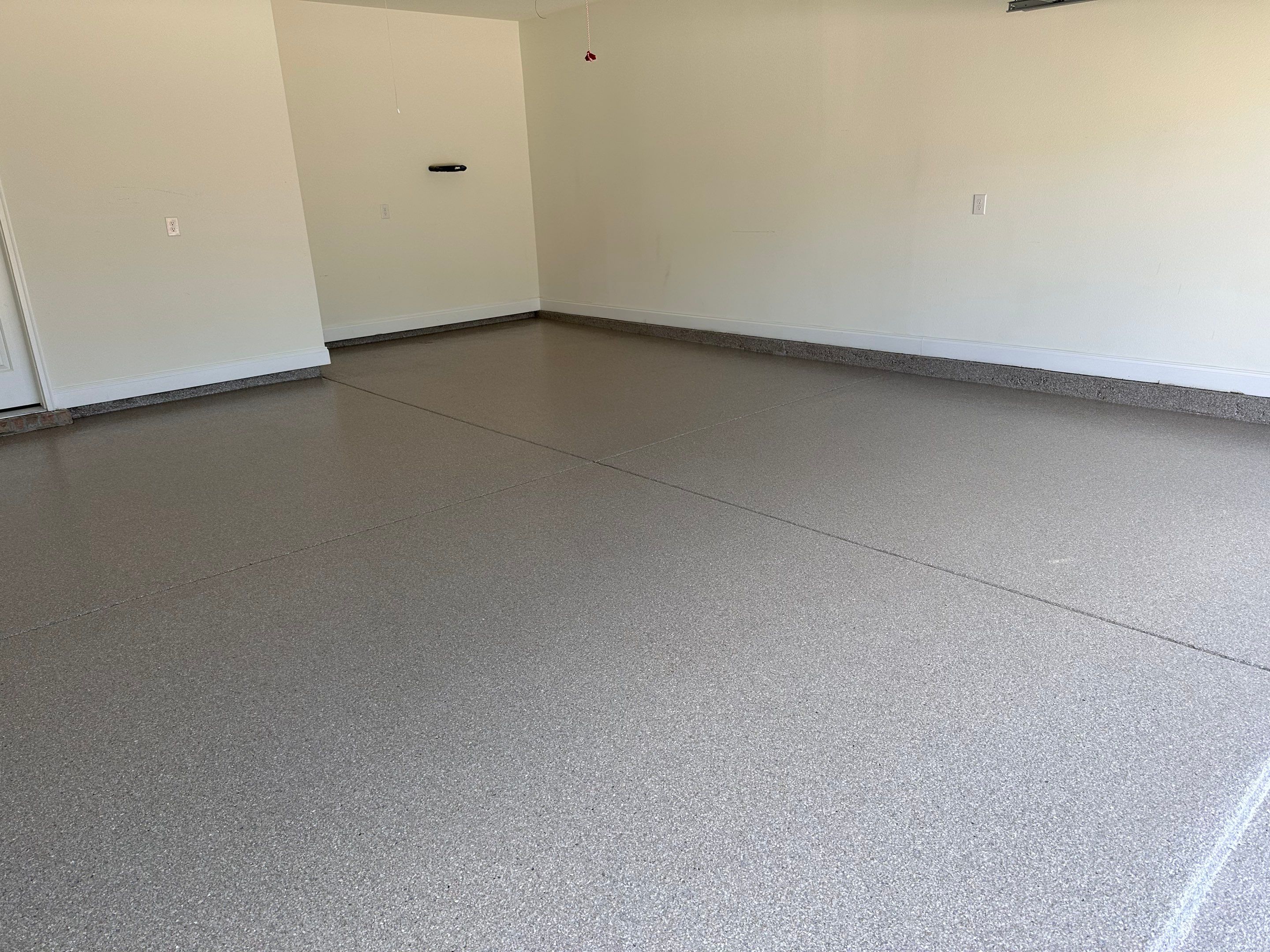 Epoxy Flake Garage and Patio Floor Coating in Cantonment, FL by Cornerstone Hard Surface Restoration 