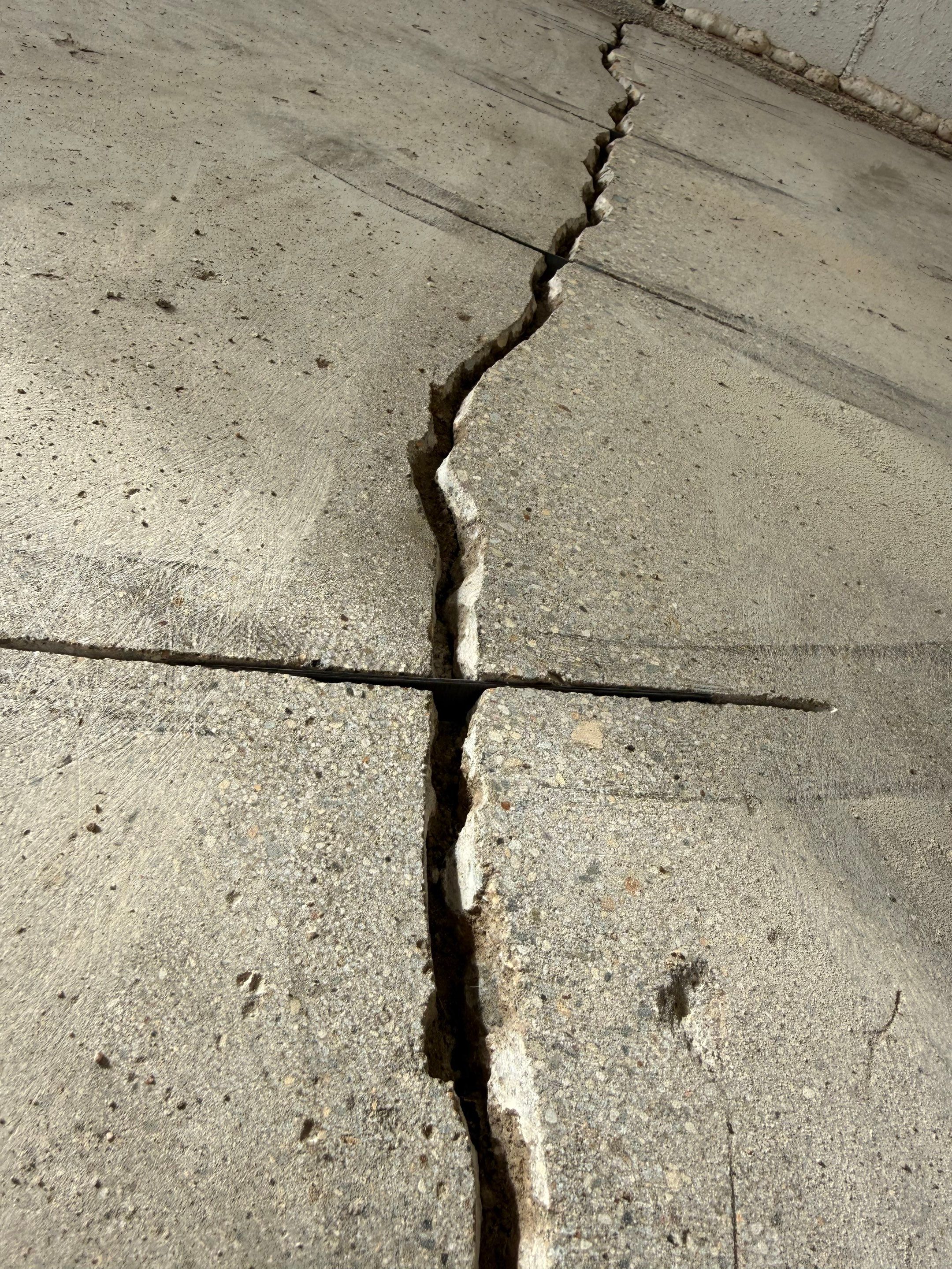Feather Grey Garage Floor Coating and Crack Repair in Beresford by Select Painting, Coatings & Garage Cabinets