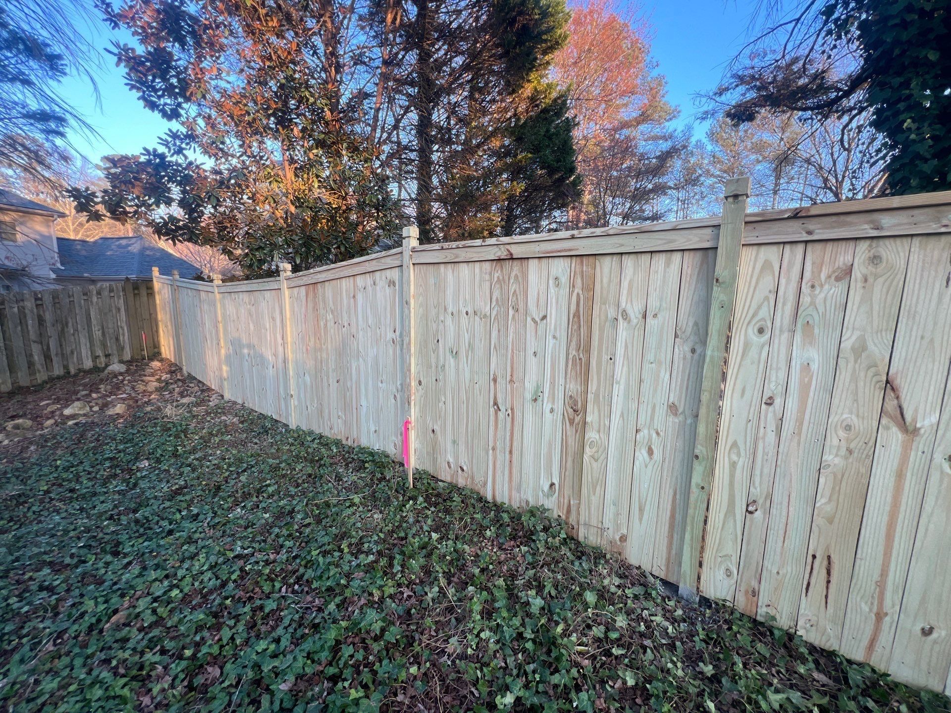 Pressure-Treated Wood Fence Installation and Deck Staining in Atlanta by Swift Home Renovations