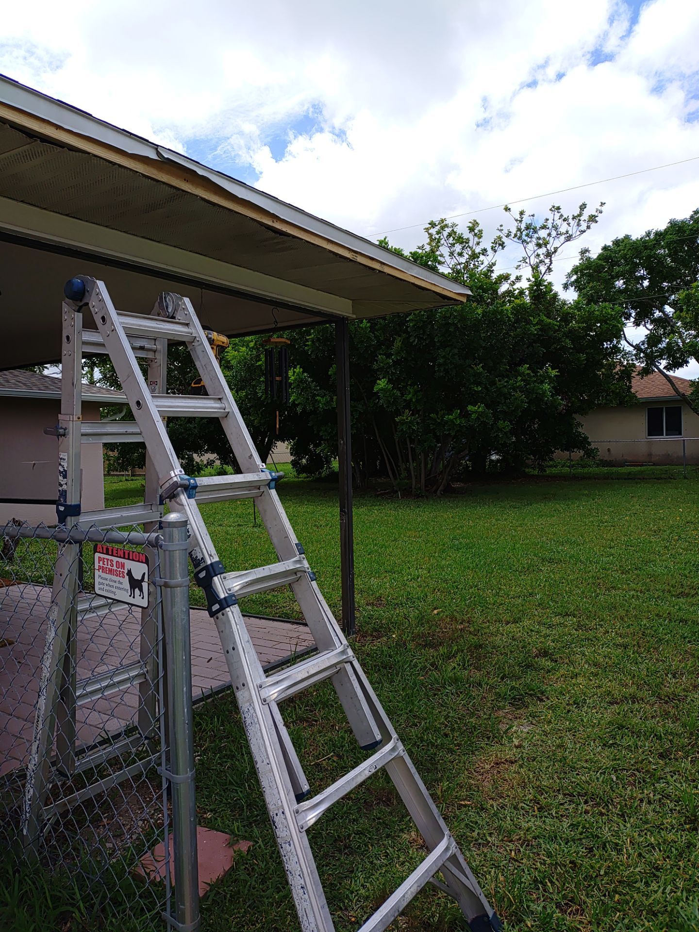 Replace gutter using White Down Spouts in Cape Coral FL by Gutter Professors