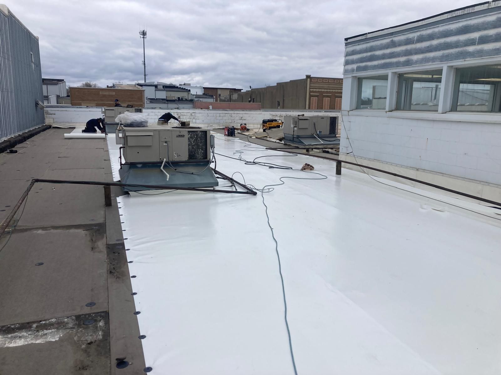 Full Roof Tear-off with new Code ISO insulation and 50 Mil Membrane by Grell Roofing, LLC