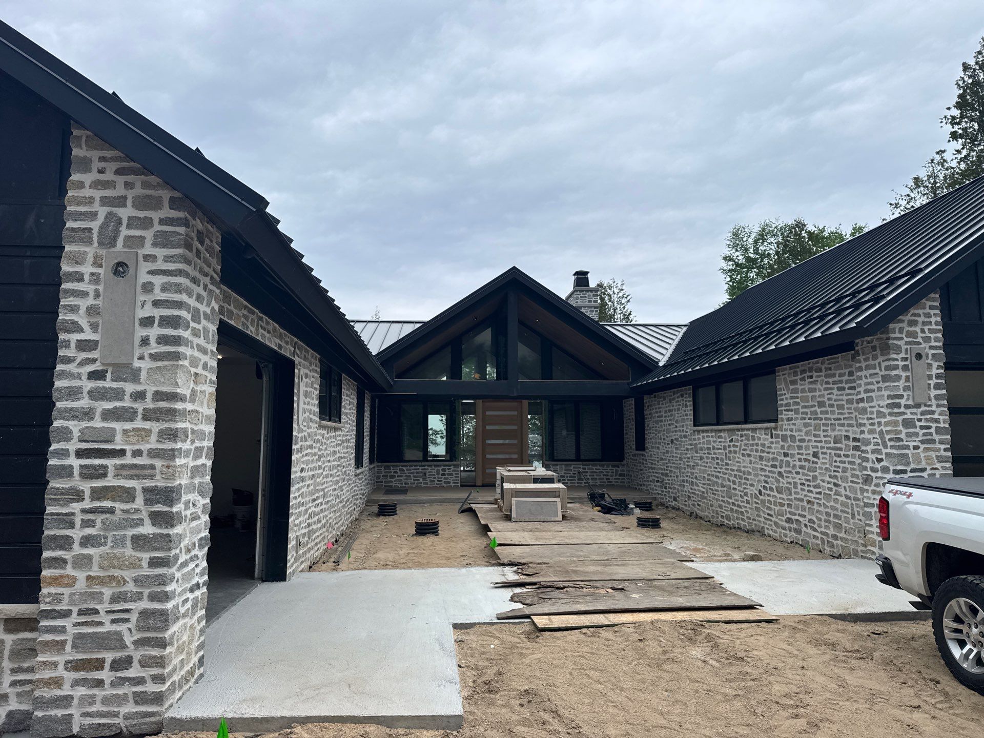 Gutter and Drainage System Installation for Modern Residential Build by Rainbow Seamless Systems