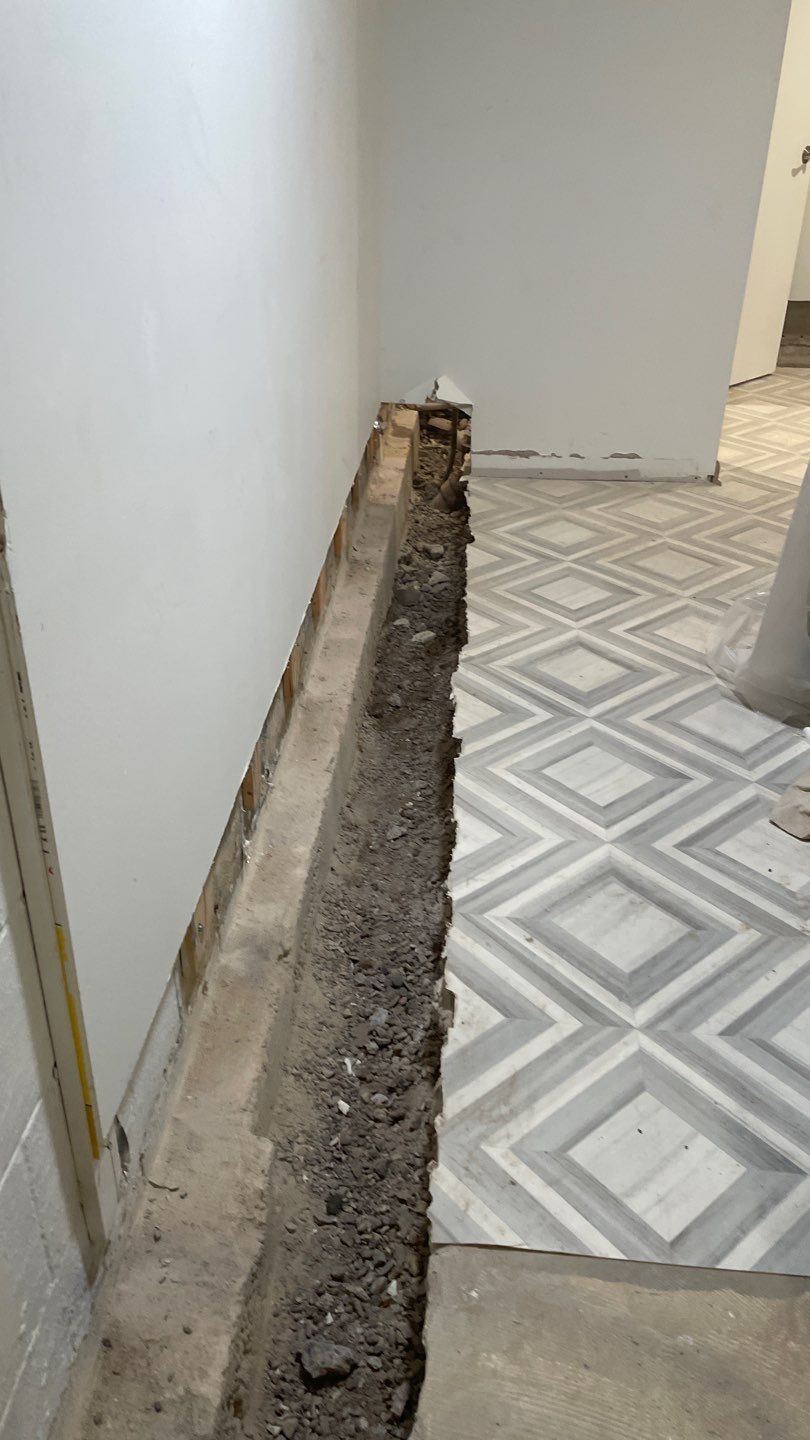 Interior Drain Tile & Buried Discharge in St. Anthony, MN by Waterproofing Northeast
