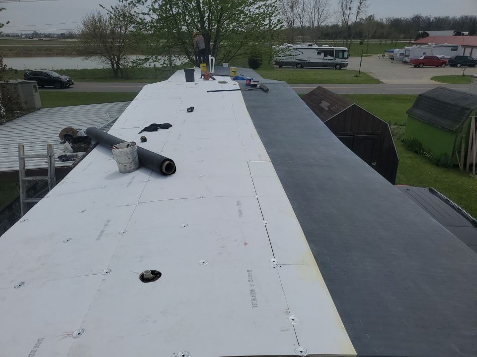 Residential Roofing Installation using 60 mil rubber roof  by Nitro Roofing and Construction