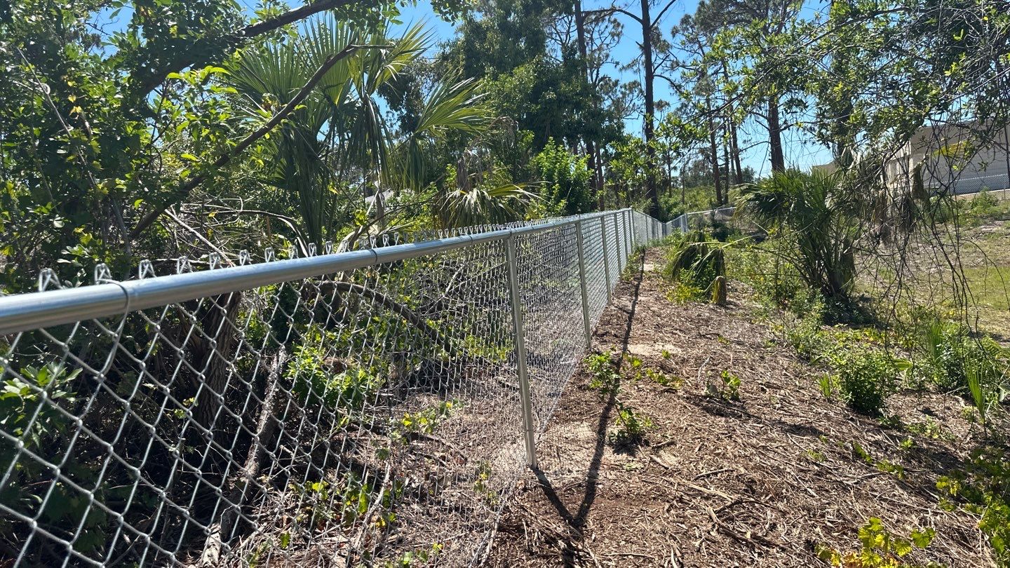 Commercial Chainlink and Vinyl Fence With Aluminum Framed Gates On Dumpster Enclosure by Asap fence and gates, LLC