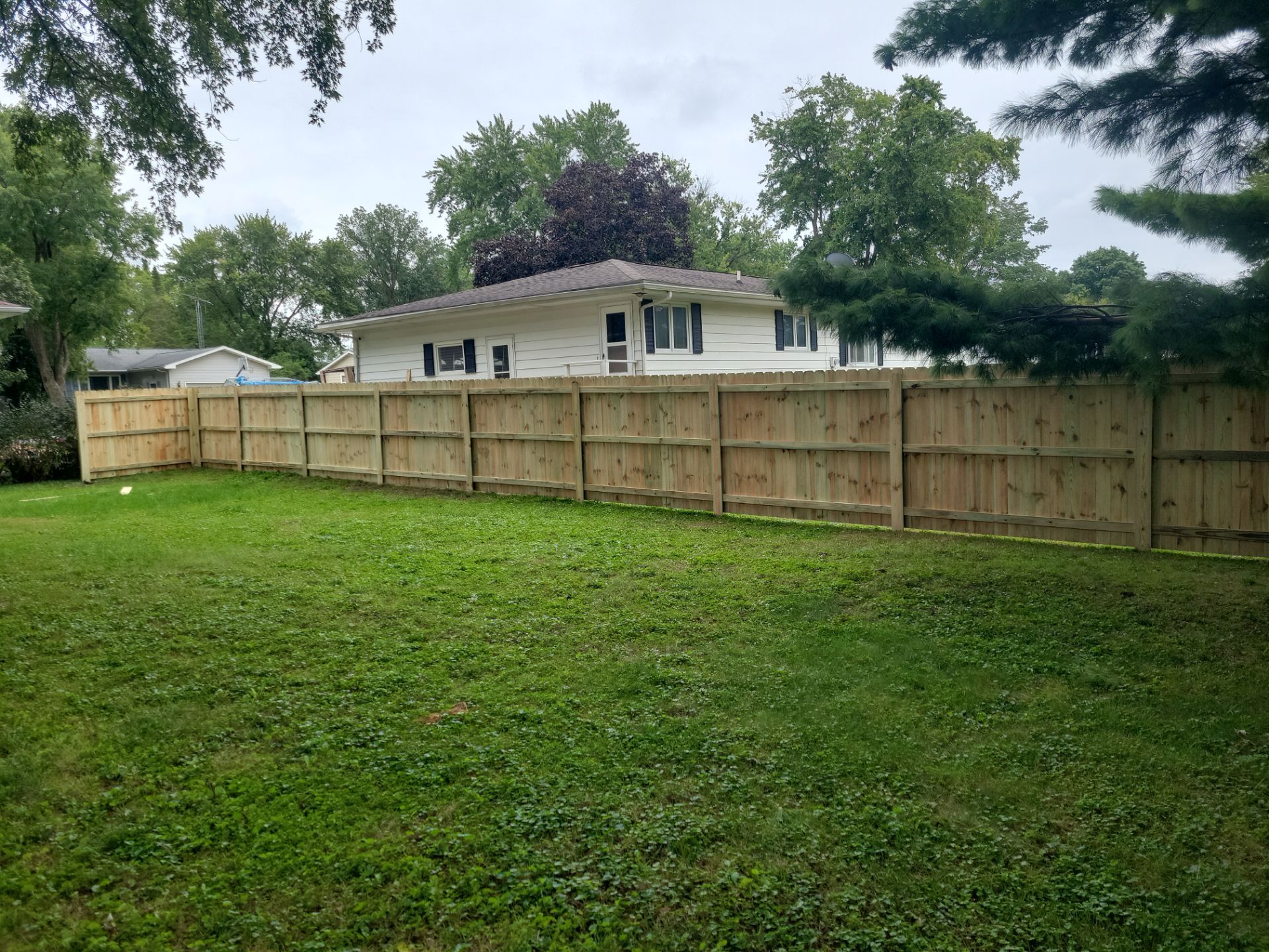 Pressure-Treated Wood Privacy Fence Installation in Waverly by Perfect Picket Fence and Stain
