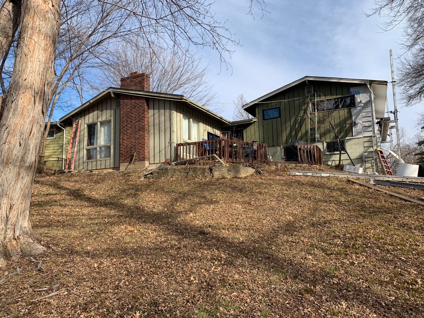 White Craneboard Siding and Heartland Window Installation in Parkville by EEC Windows, Siding & Roofing